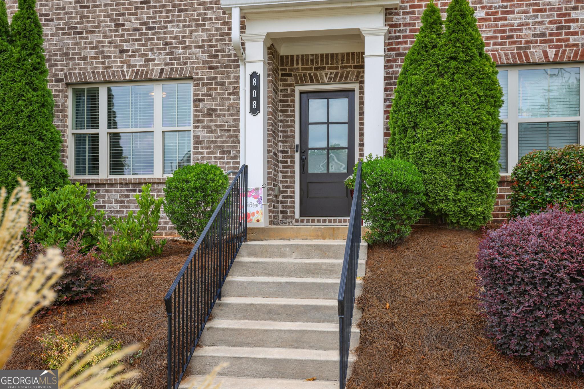 Welcome to your new home! Prepare to be captivated by this beautiful and well-maintained 3-bedroom, 3 1/2 -bath townhome in North Square just off Historic Marietta Square. This home combines location, luxury, and leisure, creating an irresistible opportunity for those seeking an extraordinary lifestyle. Step inside, and your eyes will immediately be drawn to the impeccable craftsmanship and meticulous attention to detail. The main level is perfect for entertaining! Enjoy your guest with the open floor plan from the kitchen to the airy and spacious family room. This home features hardwood floors in every room, recessed lighting and crown molding throughout, iron banisters on the stairs, and a beautiful stone fireplace with a cedar wood mantle. Prepare to unleash your inner chef in the gourmet kitchen, featuring top-of-the-line appliances, granite countertops, and ample storage space. The adjoining dining area provides the perfect ambiance for family meals. The primary bedroom bathroom has a quartz countertop and an extra-large shower. The two-car garage has an epoxy floor, insulated garage door and overhead storage racks. North Square has a pool, fire pit, and large dog park for your furry friends. Take a short walk and venture into the vibrant Historic Marietta Square where you can enjoy one of the many charming restaurants and art galleries or attend one of the many festivals and concerts. North Square is conveniently located next to WellStar Kennestone Hospital and medical district, easy access to the interstate, and Kennesaw Mountain National Battlefield and its 23 miles of hiking trails.