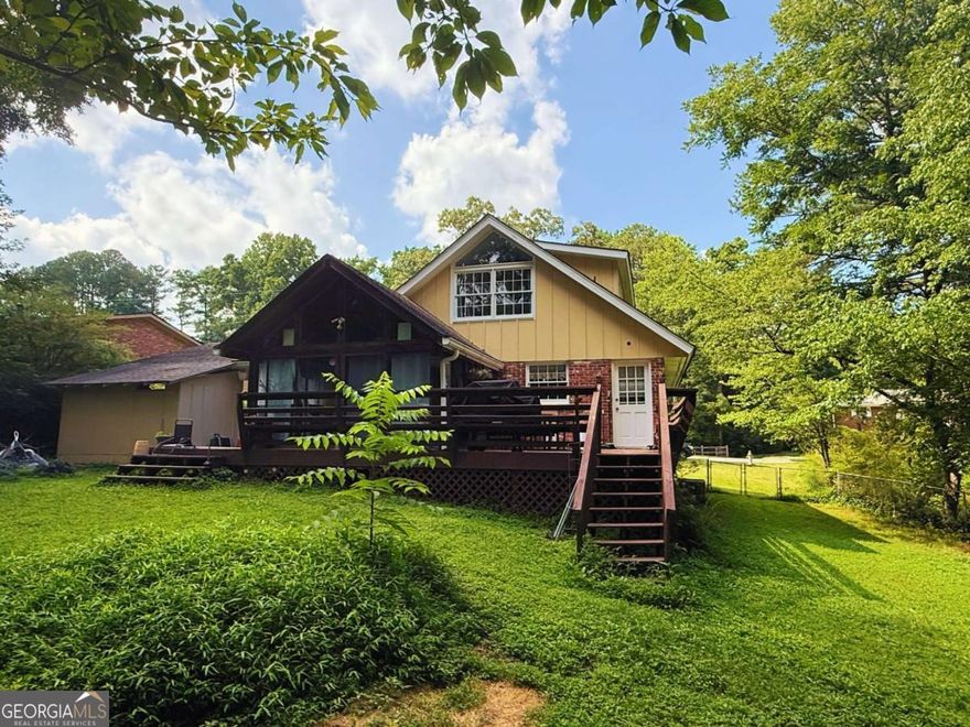 Charming 4-Bedroom Home in a desirable East Cobb subdivision - HUGE LOT, No HOA, No Rent Restrictions!    Welcome to this spacious and inviting 4-bedroom, 2-bath home nestled in the peaceful Red Oak Park neighborhood. Located on a quiet street in sought-after East Cobb, this home blends character, comfort, and convenience - perfect for families or investors alike.    With generous square footage and charming details throughout, this is a rare East Cobb rental opportunity with multiple rental strategies that are possible (LTR/STR/MTR/Room By Room).     Step inside to discover hardwood floors throughout - no carpet in sight! The updated kitchen (renovated just a few years ago) features modern stainless steel appliances and ample counter space. This home is home move-in and rent ready.    The main level offers two bedrooms and a full bath, while upstairs you'll find two oversized bedrooms with charming vaulted ceilings and dormer windows, creating a cozy yet spacious retreat.    The living room flows beautifully into a large, vaulted screened-in porch - a perfect spot for morning coffee or evening gatherings. Step out onto the adjoining deck with built-in seating, ideal for grilling and entertaining. The fully fenced backyard offers plenty of space for pets or play.    With generous square footage and charming details throughout, this is a rare opportunity in East Cobb you won't want to miss!