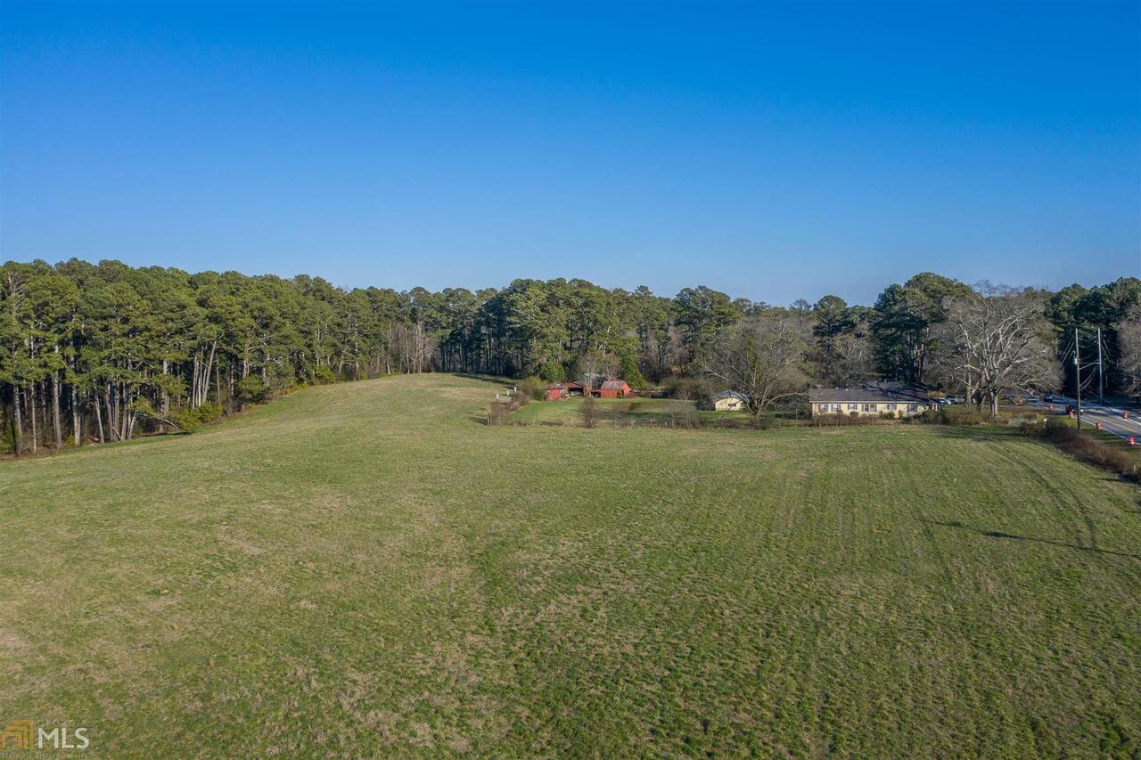 One of the last tracts of raw land in the Milton High School footprint. Approx 34 acres of beautiful land perfect for an executive retreat with a caretaker home in the existing 1930s bungalow.Or develop as a subdivision of luxury homes in the City of Milton. Operated as a farm since 1953 by the JL English family.Now Estate and family owned.Open pasture land plus partially wooded tract with mixed pine, hardwoods. Property is fenced and surveyed.New roundabout being built at corner of Mayfield Rd. Bethany Rd abuts the property.Sewer in the street on Mayfield Rd.Zoned AG1. First time on the Market. This approx 34-acre farm was purchased by JL English in 1953.Mr. English raised corn, hay, black Angus beef cattle and prize-winning tomatoes. Helen C English died in April 2019 at 94 years of age and the farm is now held in her estate. Rolling green pastures face Mayfield Road and flank the existing white farmhouse which has long been a landmark in Alpharetta, North Fulton and now the City of Milton.Mature water oaks in the front yard define the home.One of the first things Mr English did was drill a well which produces noticeably sweet spring water. The original barn standing beside the home was torn down by Mr. English when he moved a much older and larger barn from a farm closer to Crabapple to the property in the 1950s. A blacksmith shop was moved to the property at the same time.A chicken house was built later in the 1950s but this business was abandoned. A tractor shed was built by Mr English in the 1960s.Mr. English raised cattle up until the time of his death at 98 years old.This is a once in a lifetime opportunity to secure a fabulous location in between downtown Alpharetta and Crabapple. Milton High School is just around the corner.