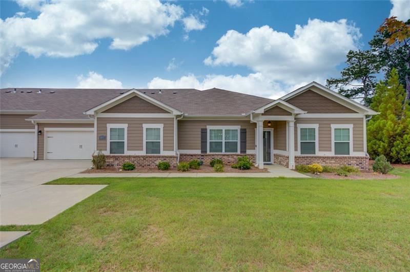 This home has distinct charm within this 55+ active adult community with gated entry. It is sitting on a homesite with a park like views seen from the sunroom which offers many seasons of enjoyment. The home welcomes you into a open floorplace w/eat in kitchen, island for casual dining, dining area option for formal dining, family room w/ceiling fan, primary suite offers privacy w/roommate plan for guest bedrooms. Hallway leads to laundry and two car garage. Swimming pool and walking distance to shopping. Located near local parks as well. Community has a clubhouse for activities as well.