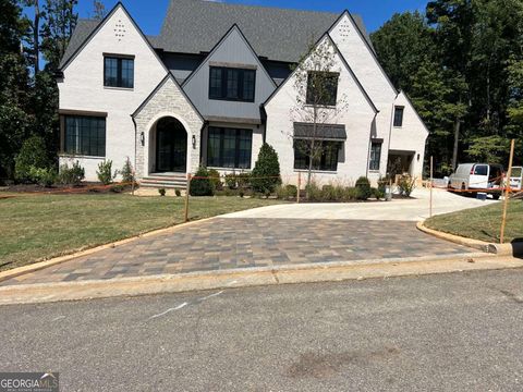 Photo of 721 Woodvale Point, Suwanee, GA 30024 (MLS # 10607915)