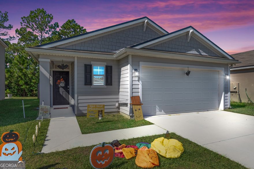 This beautiful 3-bedroom, 2-bath home features a desirable split-bedroom floor plan with luxury vinyl plank flooring throughout the living space. The open-concept kitchen offers a spacious island, stainless steel appliances, and a generous pantry with built-in shelving. Enjoy cozy evenings by the stunning modern shiplap electric fireplace in the living area. The primary suite includes a double vanity, ample storage and walk in closet. Outside, you'll find a fully fenced backyard-perfect for relaxing or entertaining. Conveniently located just 1.3 Miles from Kings Bay Naval Base and 29.1 miles to Jacksonville International Airport! Call today to schedule your showing!