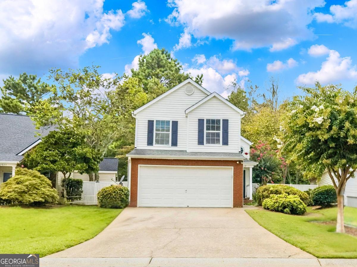 Welcome home to this beautifully updated 3-bed, 2-1/2-bath residence in desirable Britley Park, Woodstock. From the moment you enter, the 2-story family room with custom built-ins and a wood-burning stove makes a bold, welcoming statement. The kitchen features granite countertops, shaker cabinets, and luxe vinyl flooring, opening onto a spacious living area. Hardwood flooring upstairs adds warmth and flow. The primary suite is a retreat, boasting his-and-hers closets and a charming bay-window bench. Updated baths and a new water heater add modern peace of mind. Step outside to a private, fenced backyard with a huge deck and patio-perfect for gathering or downtime. HOA-maintained front lawn and shrubs mean less yard work, and community perks include parks, playgrounds, sidewalks, tennis courts, and easy access to top schools and shopping. It's the kind of home that feels both elevated and effortless. Don't wait-homes like this move fast in Britley Park.