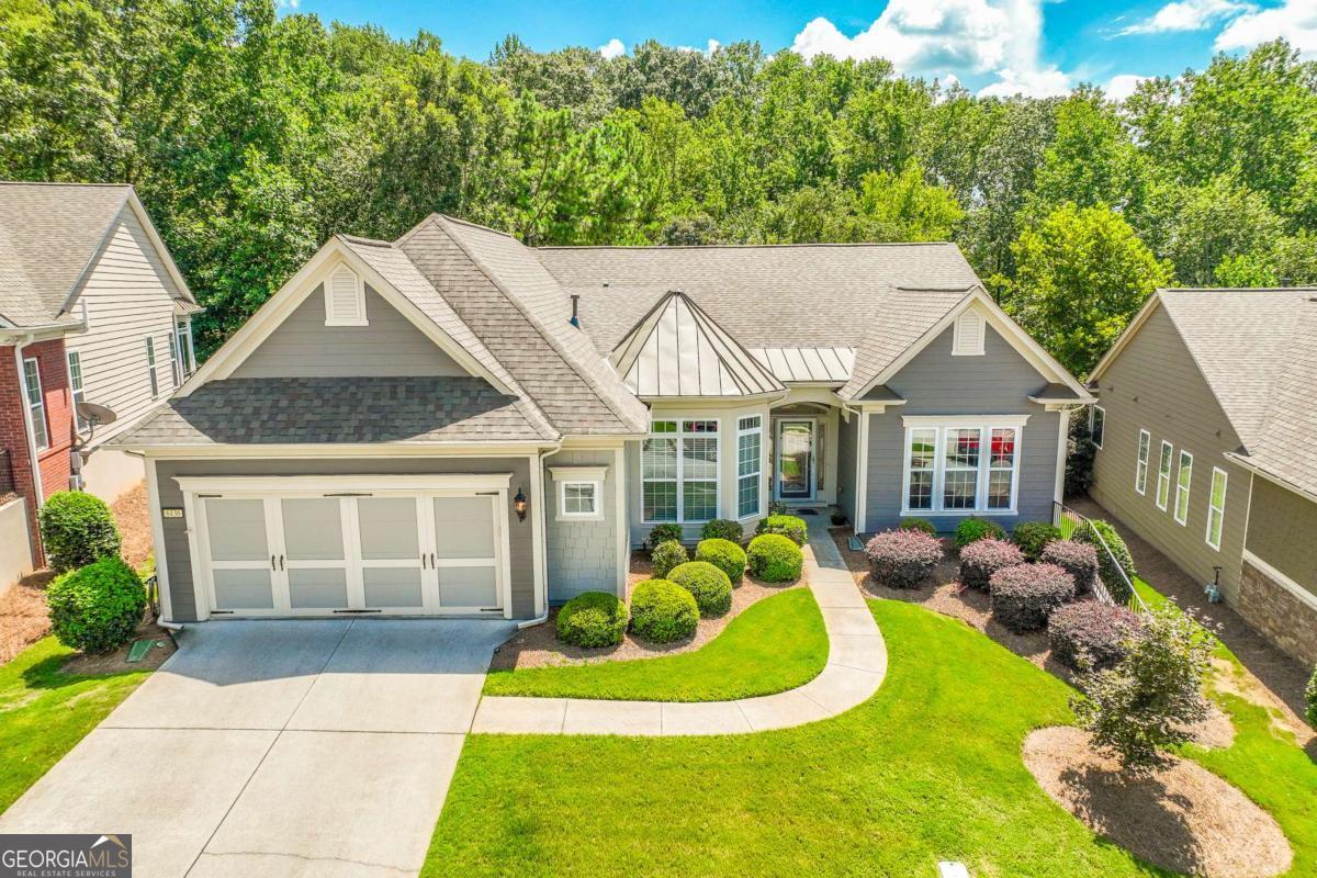 Perfect Entertainer's Home in Village at Deaton Creek, or VDC as we like to call it. This flawless ranch has 3 bedrooms, 2.5 bathrooms, an office, huge sunroom and large covered patio. It is one of the biggest floorplans with no basement or loft: 2763 sqft. (Cumberland Hall) It is located on a premium lot that backs up to a gorgeous tree line. First of all, the kitchen is lovely with newer, matching stainless steel appliances, center island, and painted cabinetry. It has both a breakfast bar and eat-in-kitchen table area. In the hallway to the garage, a wall of matching cabinets give the kitchen all the extra storage you could need. Laundry room is off this hallway. Focus on the details of this home are mandatory. The wood flooring is wide plank and is scrapped; so pretty and easy to clean. The lighting fixtures throughout, have been selected for style and functionality (large fan blades move a lot of air!) We think you will notice the pretty lighting in each room. The master bedroom is spacious with a tray ceiling. The master bath has been updated with a frameless shower enclosure, new tile, and fixtures, plus the cabinetry is the same soothing color throughout the home. You won't see many sunrooms, in VDC, like this one. It is the largest sunroom we've seen here. It is heated and cooled, it has remote controlled blinds, and so much light! But wait, there's more! The back patio has a perfect A-styled patio cover and a large ceiling fan designed to keep you and your guests comfortable white waiting for your BBQ meal to be served. The built in BBQ and counter stays with the house. You will also notice that the yard is fenced and has artificial grass. The grass was professionally installed. It is dog friendly and low maintenance. If you have not already called your agent, hopefully this gets you. The HVAC, Roof, and water heater are new. The exterior of the house has been painted. You will have a move-in-ready entertainer's dream home. Call your agent now! See you soon.