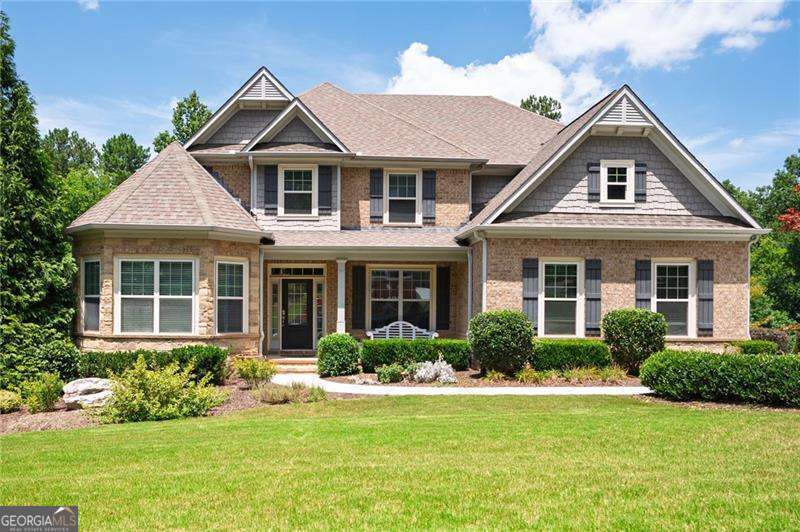 Step into a home where comfort, elegance, and nature meet. Nestled on a private and peaceful .69-acre lot, this three-sided brick beauty offers a lifestyle that's as inviting as it is functional. As you walk through the front door, you're greeted by 10-foot ceilings and a light-filled two-story living space, thanks to a dramatic wall of windows that brings the outside in. The heart of the home is its open floor plan, perfect for both everyday living and memorable entertaining. The main-level primary suite is a true retreat, complete with its own cozy sitting area and fireplace-a perfect spot to relax and recharge. Upstairs, you'll find three additional spacious bedrooms, each with direct access to a bathroom, offering comfort and privacy for everyone. The partially finished terrace level expands your living space even further, featuring a large entertainment room, a full bathroom, a dedicated workshop, and ample storage-ideal for hobbies, play, or hosting overnight guests. Outdoor living is just as magical. Two covered decks invite you to enjoy your morning coffee or favorite beverage while listening to the peaceful sounds of nature. The stone patio is the perfect place to host gatherings or soak in the late afternoon sun. There's even a fenced garden area, ready for your seasonal planting. Inside, additional features like a main-level office, a spacious sunroom, and a formal dining room give this home the flexibility to match your lifestyle. A three-car garage completes the package. All of this is located in the highly desirable Westpark community, offering amenities like swimming, tennis, and a prime location-just minutes from Kennesaw Mountain, Mount Paran Christian School, Marietta Square, and Lake Allatoona. This is more than a home-it's a place to live, grow, and create lasting memories.