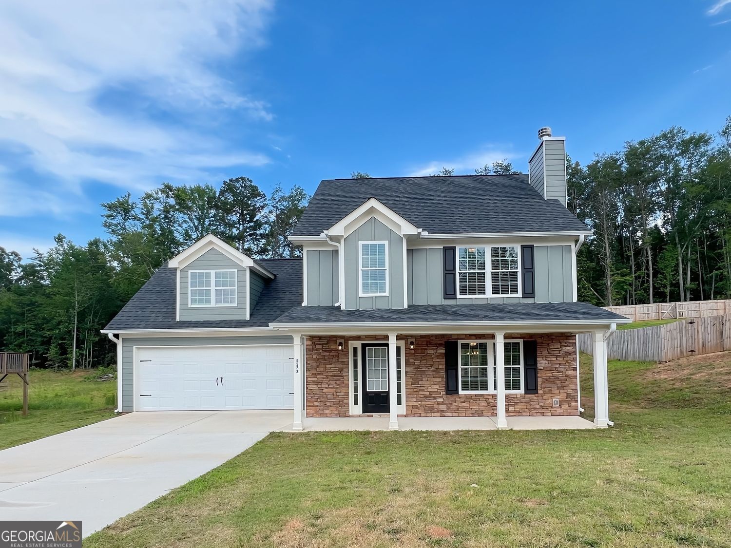 Welcome home to this beautifully maintained 4-bedroom, 2.5-bath residence at 5332 Lawson Lake Drive in Gainesville, GA. This spacious home offers a bright, open floor plan featuring a generous living area, open-concept kitchen, separate dining room, and convenient main-level laundry. Upstairs, you'll find four large bedrooms, including a spacious owner's suite with a walk-in closet and a private bath complete with a combo soaking tub and shower. The additional three bedrooms share a full hall bathroom, perfect for family or guests. Step outside to enjoy a large backyard ideal for relaxing or entertaining. Located just minutes from downtown Gainesville, Lake Lanier, local parks, shopping, dining, and Northeast Georgia Medical Center, this home combines comfort with convenience. Call to schedule your tour today.
