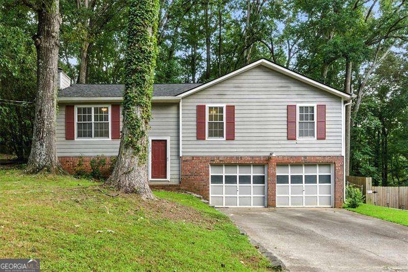 Welcome to 3849 Bentley Drive! This charming, ready-to-move-in 3-bedroom, 2-bath home is full of potential and features a brand new roof for your peace of mind. The split-foyer layout offers 1,288 sq ft of living space upstairs, along with an unfinished basement ready for your personal touch. The main level is cozy yet spacious, with a warm and inviting design perfect for everyday living. Outside, enjoy a fenced backyard with a deck that's perfect for entertaining or grilling. Whether you're a first-time buyer, an investor, or looking to create your dream home, this property presents a fantastic opportunity in a quiet Douglasville neighborhood. Don't miss your chance-bring your ideas and make Bentley Drive your new home!