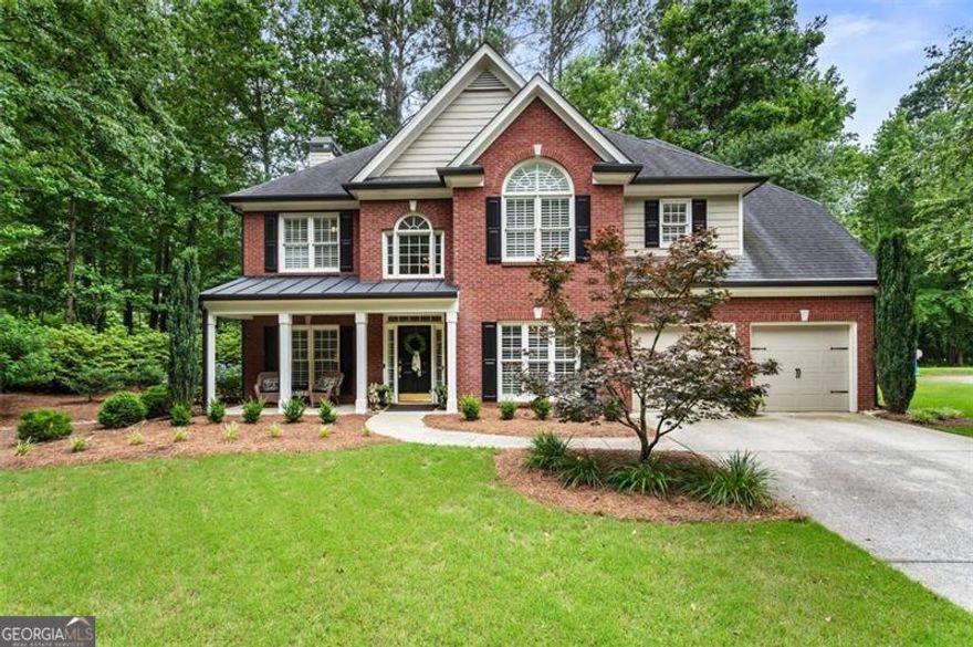 Better than New Construction! Stunning and Professionally Decorated Home that is Immaculate!  Hardwood Flooring on  Main Level* Front Porch with Room for Rocking Chairs* Formal Dining Room has Tray Ceiling and Chair Rail*  Living Room would be perfect for Reading or Home Office*  The 2 Story Family Room has a Wall of Windows and Brick Fireplace with Gas Logs* Plantation Shutters grace the Front of the Home*   Open Floor Plan with Breakfast Area and Kitchen has Large Island with Pendant Lighting, Granite Counters, Stainless Appliances, including Microwave and Refrigerator and Built In Desk*  The Main level Laundry Room is so cute with a Brick Floor, Washer and Dryer included and Cabinets for Storage*  Primary Bedroom has a Sitting Area, Double Tray Ceiling, Tiled Bathroom Flooring and Shower, Garden Tub and Walk In Closet*  All 3 Guest Bedrooms are spacious and there is a 2nd Full Bath upstairs with Double Vanities*   Smooth Ceilings throughout*  The Rear Patio is Perfect for Grilling and Entertaining*  Beautiful Lush Lawn and Landscaping*  Great West Cobb Schools, (Harrison HS)* Take a walk to the local Coffee Shop or Swim in the Community Pool*  2 Car Garage with Level Driveway*  Termite Bond in Place*  This Home Truly is a Great Value for this Location and Price!!