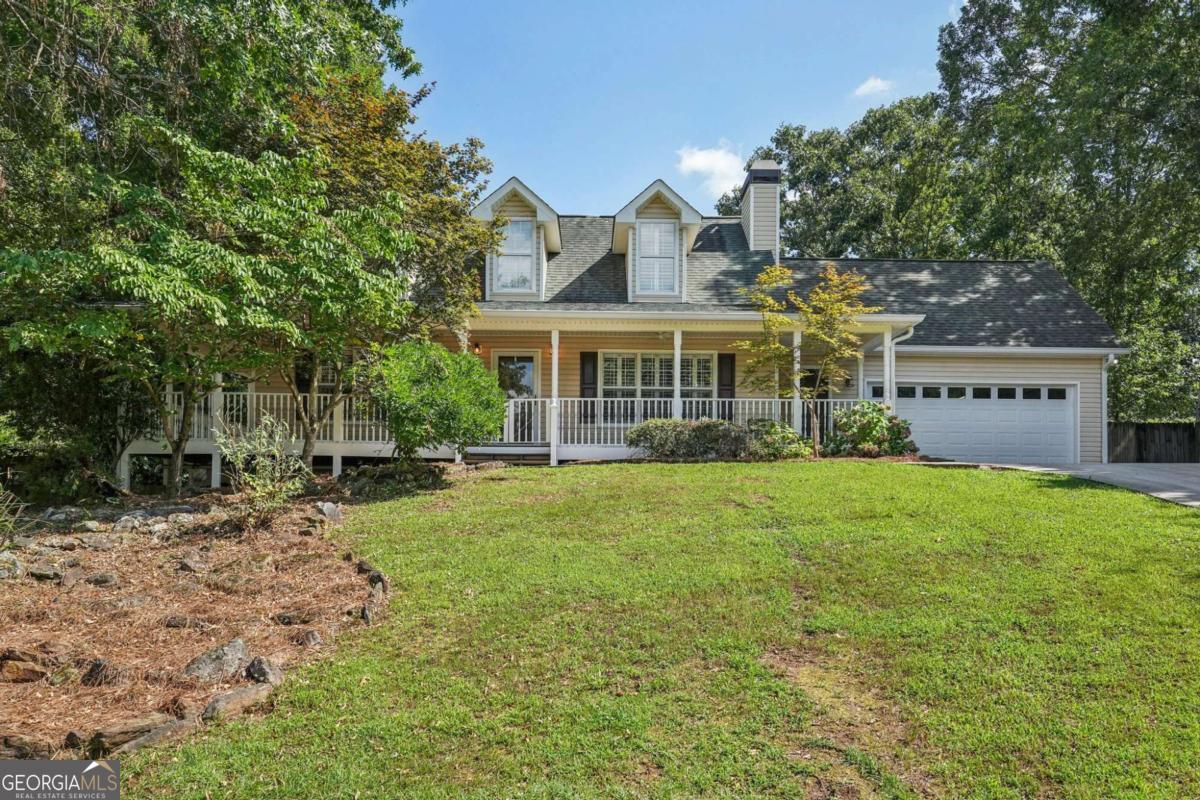 Welcome to 7005 Walnut Mill Landing - a true Southern charmer with space, style, and versatility! This beautifully maintained home offers the perfect blend of classic curb appeal and modern upgrades. Featuring 5 bedrooms, 4 bathrooms, multiple living spaces, and an oversized backyard, this property is designed for comfort, entertaining, and everyday living. Highlights you'll love: Inviting wraparound front porch perfect for rocking chairs and morning coffee Bright, open kitchen with granite countertops, tile backsplash, stainless steel appliances, and plenty of cabinet space Expansive living and family rooms with fireplaces, ceiling fans, and hardwood floors Owner's suite with spa-style bathroom, double vanity, and walk-in closet Multiple bonus rooms, office space, and built-ins - ideal for work-from-home or flex space needs Finished lower level with extra living/entertaining areas + kitchenette Spacious backyard with mature trees, firepit area, and room to play or host gatherings Covered back deck and patio for year-round enjoyment Prime Location: Nestled in a quiet cul-de-sac within a desirable community, minutes to Lake Lanier, shopping, dining, and top Forsyth County schools. This is more than just a house - it's the lifestyle you've been waiting for. Move-in ready, updated, and waiting for you to call it home!