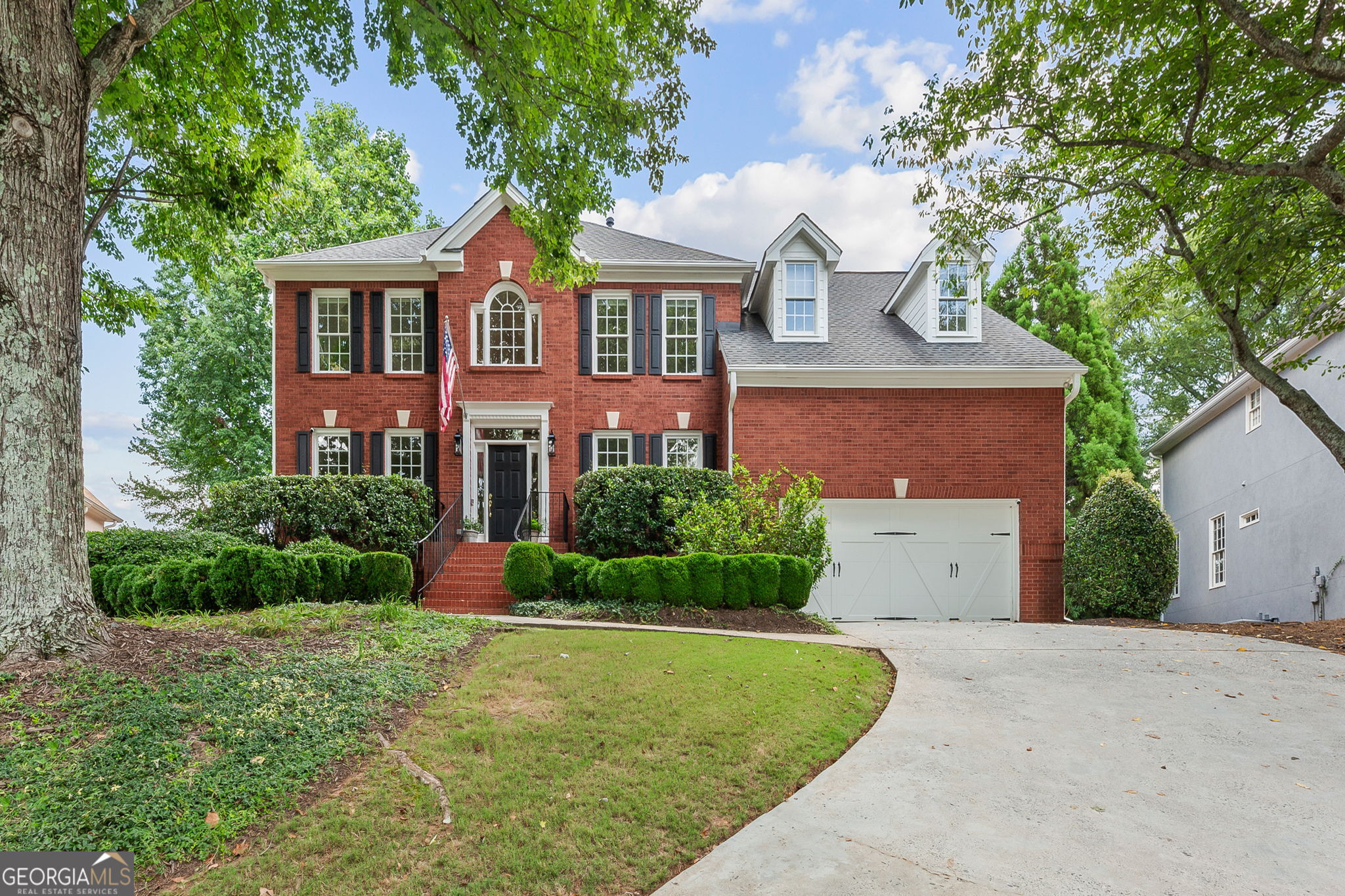 Nestled in a prime Alpharetta location just minutes from Avalon and walkable to local parks and greenways, this beautifully maintained five bedroom, four and half bath home offers the perfect blend of space, style, and convenience. The main level features a light-filled open-concept layout with an updated kitchen overlooking the family room and sunroom. A formal living room-ideal as a home office-and a separate dining room provide flexible living spaces, while the eat-in kitchen opens to a deck the full-width of the home, perfect for entertaining or relaxing with access to of the professionally landscaped, fenced backyard. A front and back staircase lead to the spacious primary suite featuring a spa-inspired renovated bath, while three additional bedrooms and two more renovated full baths, offer plenty of room for family and guests. The custom-finished terrace level adds even more living space with a media area, gym, bedroom, full bath, and ample storage. Located in a highly sought-after swim/tennis community and zoned for top-rated Alpharetta schools, with easy access to GA-400 and vibrant downtown Alpharetta, this home checks every box for comfort, lifestyle, and location.