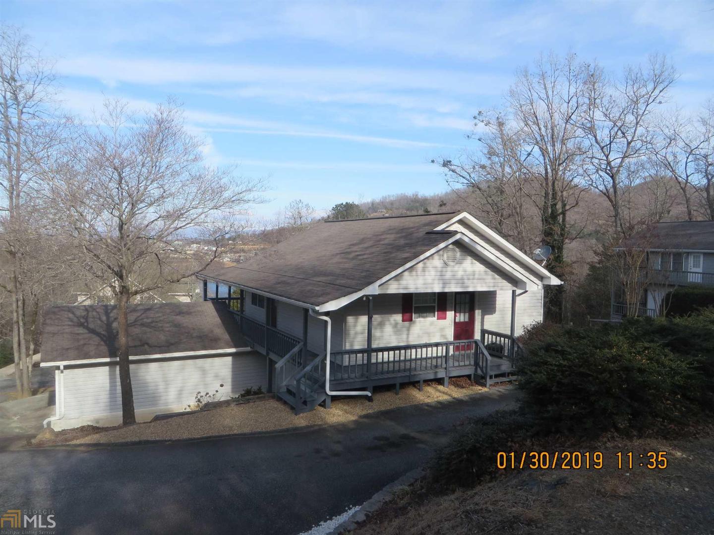 2BR/2BA home with mountain and lake views. Main Floor features laminate floors BR/BA, nice living area, and kitchen. Finished basement features living area, BR/BA. Rear porch perfect for relaxing and taking in mountain and lake views.