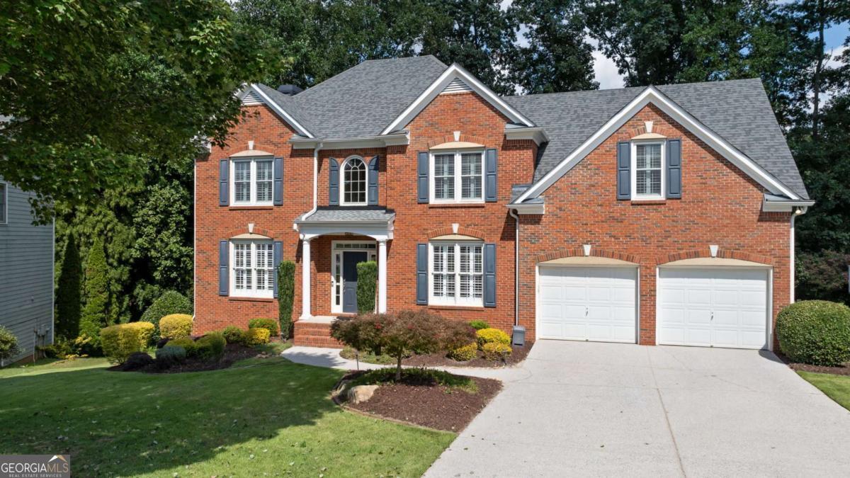 Welcome to 1224 Kenway Circle, a beautiful red-brick traditional home nestled in one of Smyrna's most vibrant and family-friendly neighborhoods, King Valley. From the moment you arrive, the charming curb appeal and classic brick elevation set the tone for what's inside. Step through the grand two-story foyer and feel the warmth of hardwood floors that flow across the main level, leading you to a formal dining room perfect for hosting holiday dinners or birthday celebrations, with sunlight streaming through a big front-facing window. Across the hall, a thoughtfully designed flex room, now a dedicated home office with French doors, makes working from home both productive and peaceful. And with ATT Fiber internet already installed, you'll enjoy fast, reliable connectivity-ideal for remote work and virtual meetings . The spacious living room is the heart of the home, anchored by a cozy fireplace, just waiting for movie nights, game days, or quiet evenings in. The kitchen is a total showstopper, recently remodeled with custom ceiling-height cabinetry, soft-close drawers, stainless steel appliances, a sleek backsplash, and an oversized island ready for baking cookies with the kids or wine and charcuterie with friends. Step outside to your private deck and imagine summer BBQs, birthday parties, and starlit conversations while the kids run wild in the fenced backyard. Upstairs, retreat to your luxurious primary suite with hardwood floors, tray ceilings, and a wall of windows flooding the space with light. The remodeled spa-like bath and large walk-in closet make it a true escape. With four more spacious bedrooms upstairs, there's plenty of room to grow, host guests, or create that dream playroom or craft space. The finished basement is the ultimate bonus, already complete with a full bath and wide-open space that's perfect for a home theater, gym, bar, game room, or kid's paradise. This is a home that grows with you. The neighborhood is brimming with amenities including a clubhouse, pool, tennis courts, and walkability to King Springs Elementary. It's full of energy with year-round events, creating a strong sense of community where neighbors quickly become friends. And the location is unbeatable, just minutes from Smyrna Market Village with boutique shopping, local wine tastings, a brewery, and great dining. Outdoor lovers will appreciate being five minutes from the Silver Comet Trail, and if you're a Braves fan or just love a great night out, you're only 15 minutes from The Battery Atlanta. ***Make this deal greater by using our preferred lender Mortgage Atlanta and receive $4000 towards your Closing Cost***