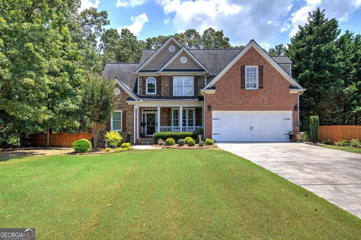 Welcome home to the stunning custom built home located in the sought after community Eagle Mountain Subdivision. The heart of the home is a gourmet kitchen with custom cabinetry and two pantries. Retreat to the large owner suite complete with a large walk-in closet with custom cabinetry and built-ins as well as a custom marble vanity, while three additional bedrooms offer comfort for family and guest. Walk outside to the large level fenced in backyard overlooking a 25x25 basketball court, with endless possibilities for use as well as a cottage style storage building with deck. This home also features custom millwork and details at every return, with a cozy brick fireplace with gas logs. Both HVAC units have been recently replaced. Totaling over $20,000 as well as a new hot water tank. Beautiful well-maintained yard and upgraded landscape. Schedule a showing today!