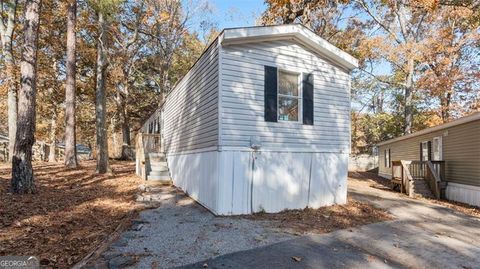 Photo of 6266 DORSETT SHOALS Rd #302, Douglasville, GA 30135 (MLS # 10644636)