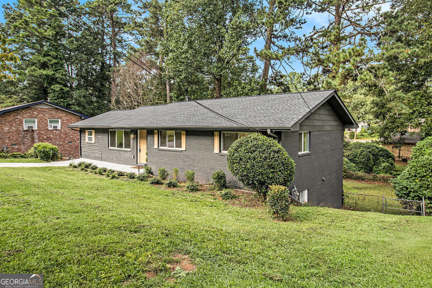 This stunning 4-sided brick ranch on a finished basement has been thoughtfully updated for flexible living. Featuring 5 BEDROOMS, one staged as an OFFICE WITH CLOSET, and a BONUS ROOM, there's more than elbow room for everyone. The open-concept layout showcases a FULLY RENOVATED KITCHEN WITH AN ISLAND, QUARTZ countertops, and NEW stainless steel appliances-perfect for entertaining. Enjoy 3 FULL BATHROOMS (one is an ATTACHED EN-SUITE WITH OVERSIZED CLOSET), stylish NEW FLOORING, and UPDATED RECESSED LIGHTING throughout. With a NEW ROOF, GUTTERS, WATER HEATER, and HVAC, this home offers worry-free living. Conveniently located in Decatur near Hwy 20 & I-285 and just 15 minutes from downtown Atlanta. This one stands out amidst all others, so come see for yourself. Make this home even better because it qualifies for a Conventional Loan with the community lending program which gives a lower rate because of address! AND, Preferred Lender will give UP TO $1500 CONTRIBUTION which can be applied toward the buy down. Reach out to Devorah Shaw from Atlantic Bay Mortgage Group @ 404-308-0098 for more info
