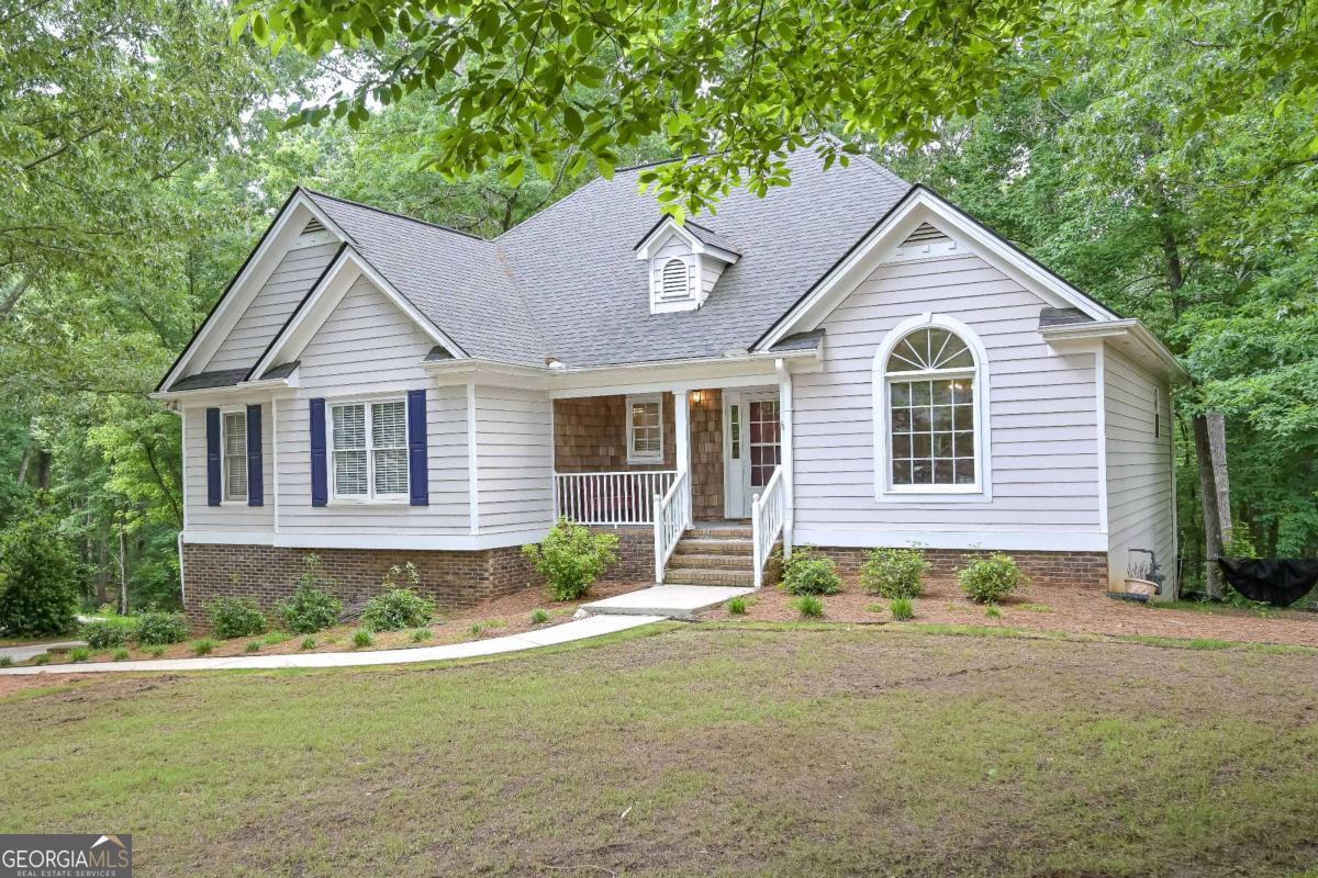 $5,000 SELLER CONCESSION!!!! USE FOR CLOSING COSTS, BUY DOWN YOUR RATE, WHATEVER YOU CHOOSE!!! Southern living at it's finest. This charming 3 bed 2.5 bath is tucked in on large wooded lot with fenced back yard. Quaint rocking chair front porch welcomes you home. Inside, you will find open airy floor plan featuring spacious living room with soaring vaulted ceilings and cozy fireplace, leading to an expansive eat in kitchen featuring solid surface countertops and stainless appliances. Glass enclosed sunroom is ideal for quiet time and relaxing with a warm cup coffee. The main level offers spacious owner's suite with spa bath complete with his/her vanities, separate shower, large soaking tub and walk in closet. Two generously sized bedrooms are joined by jack and jill bath with dual vanities. Partially finished basement offers huge flex space with endless opportunities, whether it be home office, teen suite or game room for the kiddos. Immaculately maintained and located in sought after neighborhood. This gorgeous house is ready for a new family to make it HOME!!!