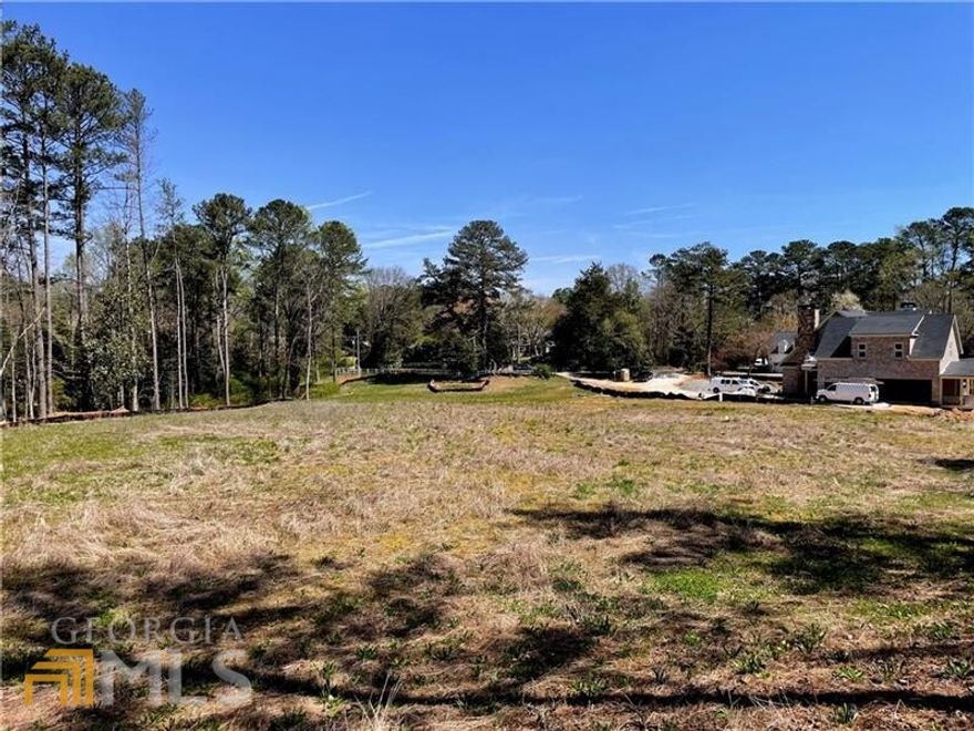 Idyllic 2.37 acre build site located in one of Atlanta's most desirable communities. Top rated schools; Sope Creek Elementary, Dickerson Middle and Walton High.  Historic Dickerson Road in East Cobb is just 3.4 miles from the Chattahoochee River at Johnson Ferry.  A hidden gem with over 400' of depth and over 300' of width at the rear.  This picturesque property will easily accommodate a sprawling estate with pool and / or additional detached structures.   The gentle topography creates the opportunity for a rare walk out yard and pool site.   A stand of trees across the back of the lot creates a natural privacy buffer.  Opportunity knocks!  Survey available upon request.