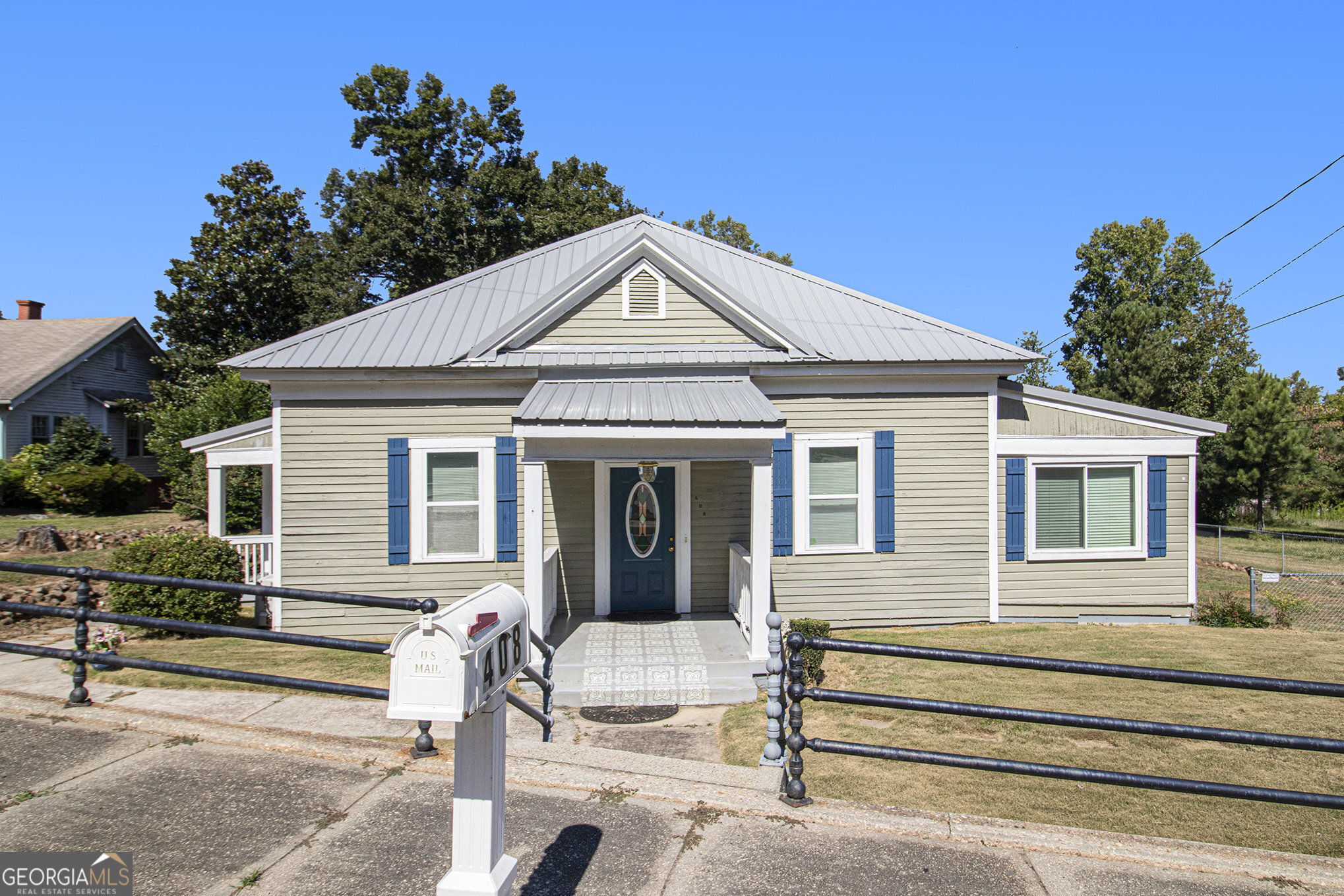 Charming 1910 Home with Modern Updates! This beautifully updated 1910 home has been given a fresh face lift while preserving its timeless character. You'll love the oversized rooms, wide central hallway, soaring 12-foot ceilings, multiple (decorative) fireplaces, and the rich, thick moldings around windows and doors that reflect its historic roots. Modern upgrades blend seamlessly with the old-world charm, including brand-new central heat and air, efficient vinyl windows, and updated bathroom fixtures. The enormous living room opens to a bright sunroom through original French doors, creating the perfect space for relaxing or entertaining. A separate dining room connects conveniently to both the kitchen and living room, ideal for gatherings. The spacious kitchen features a central island, new countertops, and brand-new appliances-including a dishwasher and range-ready for your culinary adventures. Seller is offering $8,000 to the Buyer towards Closing Costs.