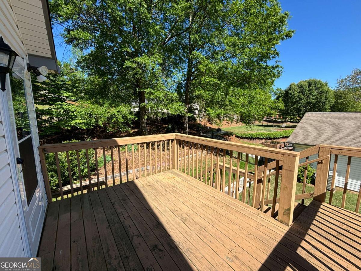 Freshly updated 1BR/1BA upstairs apartment located above a detached garage (no garage access). This well-maintained unit offers clean, efficient living with modern updates and convenient access to shopping, dining, and parks. Rent includes lawn care, water, and trash service. Total electric. No washer/dryer hookups; however, a local pickup/drop-off laundry service is available and highly recommended. Upper level only. Maximum occupancy 1 person (due to septic system). No pets. Owner resides on site. (Property managed by Move Realty Co. Owner is related to the property manager, who holds an active Georgia real estate broker's license.)