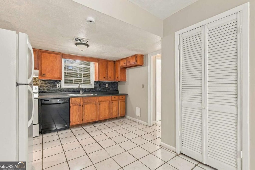 Photo of 1166 Shoreham Drive, Atlanta, GA 30349 (MLS # 10849667)