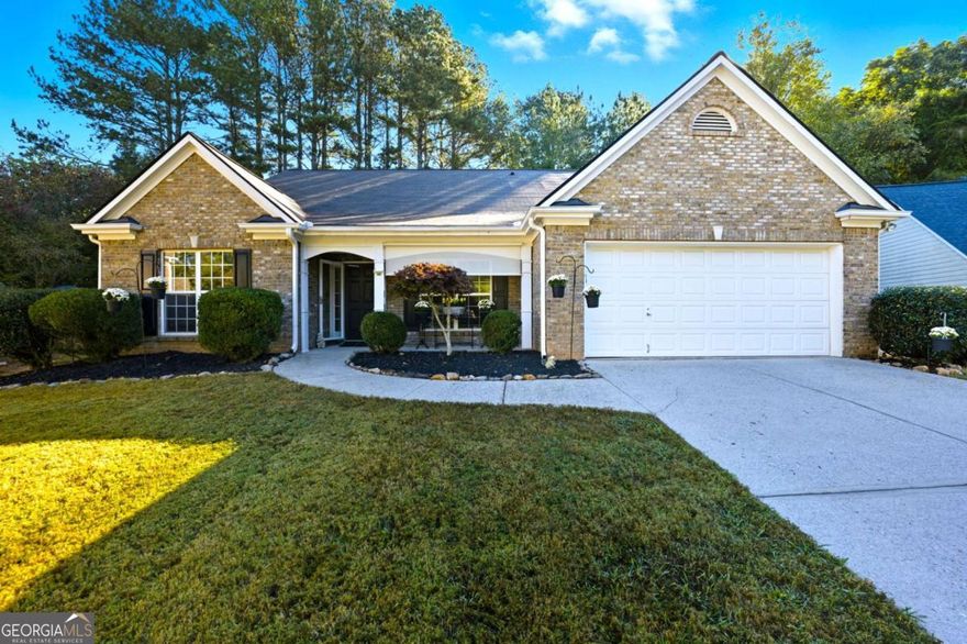 Impeccably updated and ideally situated, this stunning 4-bedroom home in Dawsonville offers a blend of style and sanctuary, perfectly positioned on a quiet cul-de-sac on a private, half-acre lot. This home is completely step-free (or features a zero-entry design) with gorgeous, low-maintenance luxury vinyl plank flooring flowing throughout for effortless living. The heart of the house is the beautifully renovated kitchen, featuring sleek white cabinetry, sparkling quartz countertops, and high-end smart appliances. For ultimate peace of mind, the property includes a whole-house generator. With a wooded backyard providing a peaceful, private retreat, this property delivers both elegance and tranquility, all while maintaining excellent access to GA-400, the North Georgia Premium Outlets, and the area's scenic mountain and lake attractions.