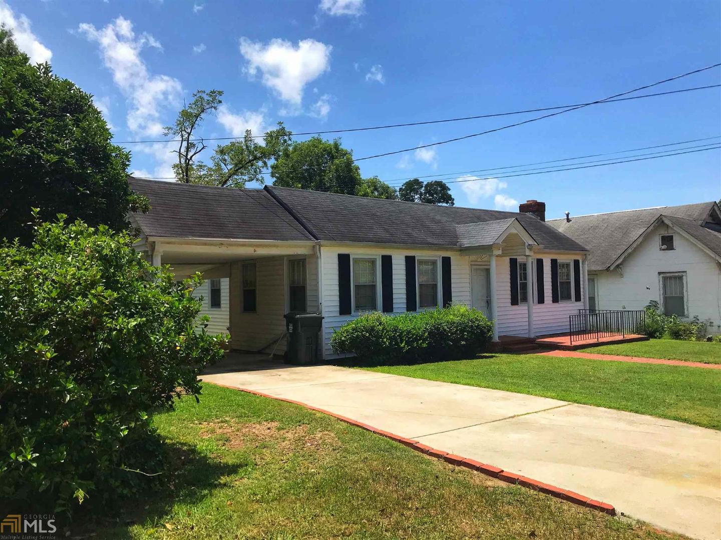 Charming 2br/1ba home with large back yard. Located in Historic Downtown Hogansville and 3 minutes to I85. Lots of natural light throughout the home. 9 ft ceilings, sunroom/laundry room and a spacious Kitchen. Beautiful harwood floors. Well maintained with lots of character. Call today to schedule your showing! Located behind the home is the original family cottage. This space provides the new owner with a unique opportunity to create an additional family/entertainment area. Walk to shops, restaurants, elementary school, etc...