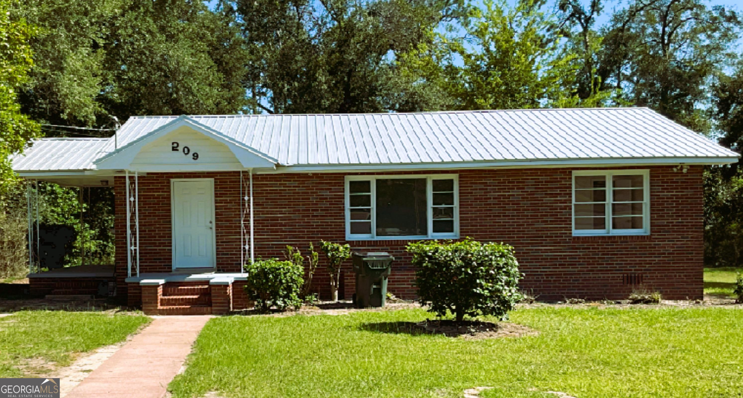 Welcome to this charmingly remodeled brick home in Swainsboro, Georgia! Perfect for a young family or a retired couple, this lovely residence offers three bedrooms and 1.5 bathrooms. Enjoy brand-new flooring, fresh paint throughout, and a beautifully updated kitchen featuring modern cabinets and new appliances. The home also has a wonderful outdoor area with a large concrete patio. This move-in-ready home combines comfort and style, waiting for you to make it your own.