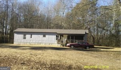 7 acres with a 1983 singlewide mobile home. 14X60 Gorgeous building lot in the heart of Roopville. This is also a wonderful addition to a rental portfolio. The mobile home is rented at this time so you cannot view the inside without an offer in place. Property is a portion of the tax parcel number plus an additional tax parcel. Call LA for details. Property is being sold "as is" "where is". There is no sellers disclosure, seller has never occupied the property. Seller makes not warranty.
