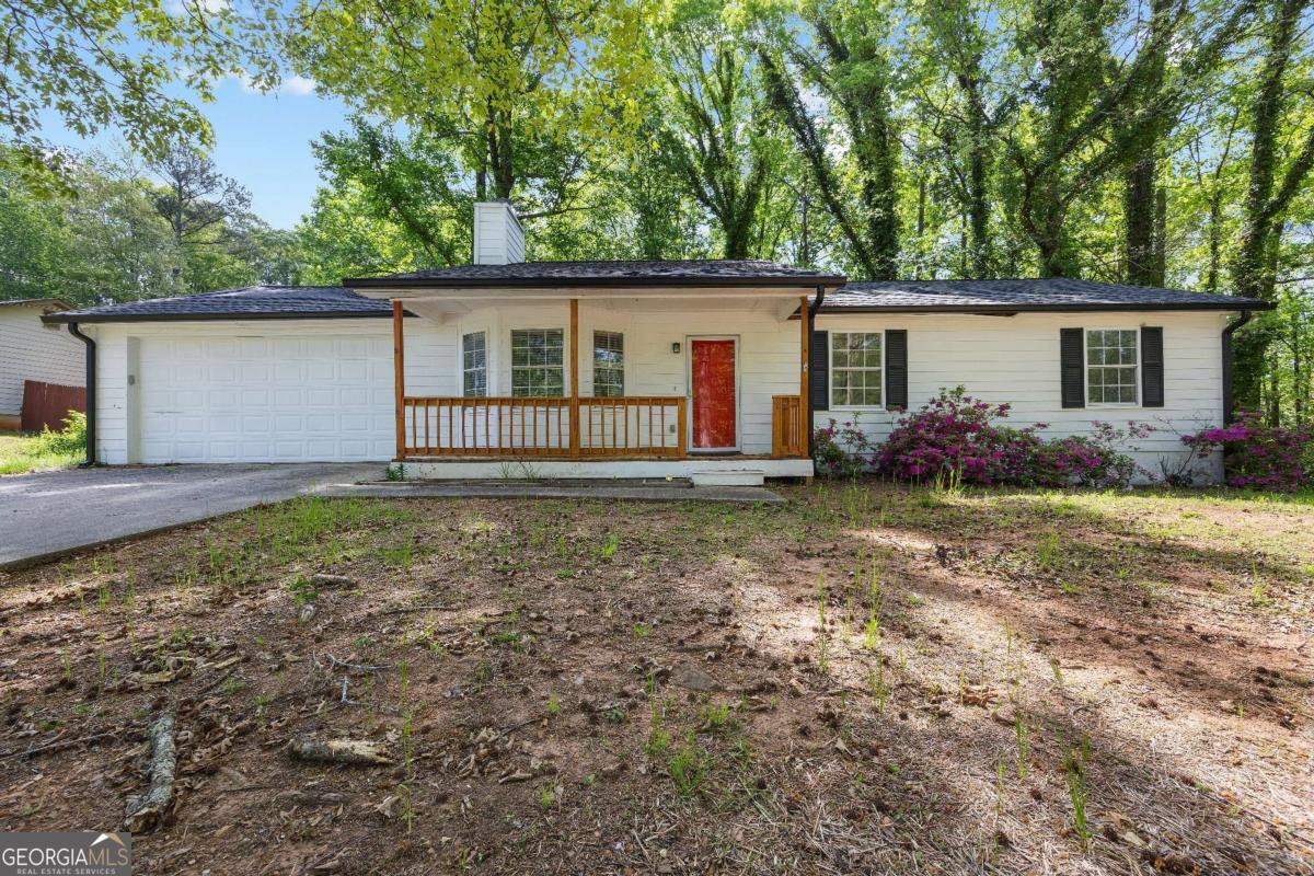Beautiful 3 bedroom 2 bath. Upon arrival you will find a stunning red door with a wood front porch. When you enter the home you'll be met with a spacious living room and a stunning fire place to the right will be your first bathroom accessible to all bedrooms.Your master bedroom has two closets! Straight ahead from the living room you will find the kitchen along with a perfectly tucked away laundry area which will lead out to a great size back yard backyard with a wooded deck.New dishwasher installed 2024 along with roof, gutters, vinyl wood floor in all bedrooms, living room fan. Renovated kitchen cabinets and fresh painted. Motivated Seller!