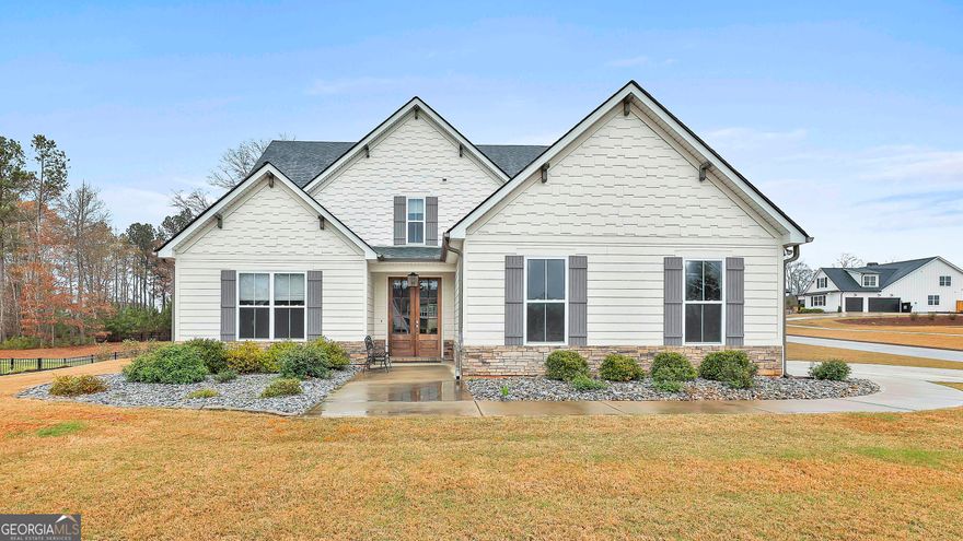 Better than New! Fabulous 5-bedroom 3 full Baths home in Northshore! This open floor plan features an open kitchen overlooking the Family gathering room with a Fireplace.  Owner Suite is spacious, on the main level with a bath with a separate shower and soaking tub.  Also on the main level is an additional bedroom for guests or an office plus an additional full bathroom.   Wide hardwood stairs take you upstairs to 3 additional bedrooms plus a spacious bathroom.  The third bedroom upstairs is oversized and can also double as an additional hangout room.  Most of the flooring is laminate hardwood with carpet in some of the bedrooms.  The backyard is fenced-in with an upgraded fence.  Walking distance to the neighborhood pool and amenities. Ready to Move In!