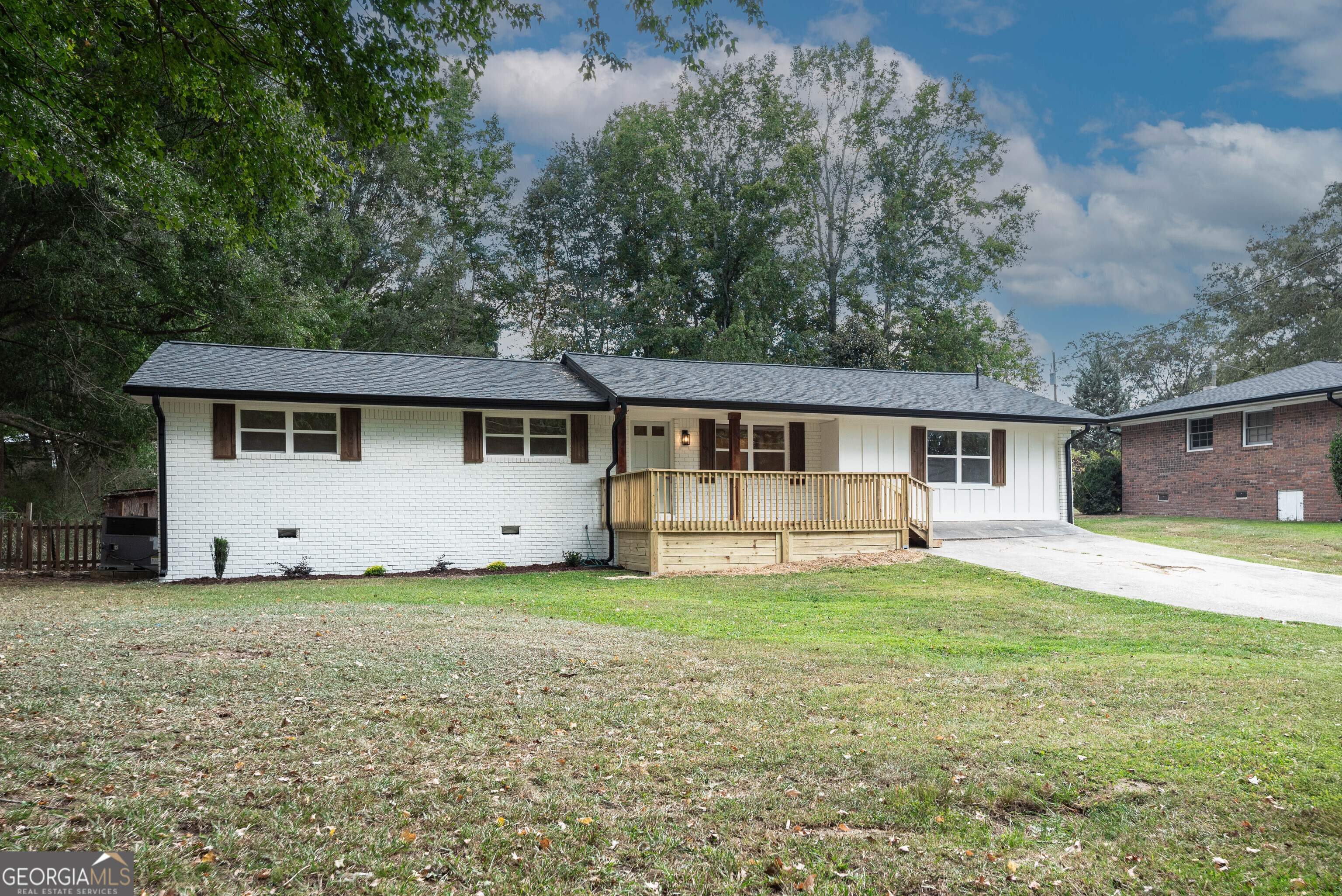 A MUST SEE! This pristine four-sided brick ranch has been completely remodeled from top to bottom-every detail has been thoughtfully updated, ensuring a stylish and modern living experience. Step inside and immediately notice the open floor plan where a bright, airy living room seamlessly flows from the newly renovated kitchen. Entertain friends and family in a space that boasts stunning new cabinetry, sleek countertops, and a striking tile backsplash. Every feature of this home is like new. Enjoy the modern comfort of new windows, a new roof, new HVAC system, and new flooring throughout. Luxury abounds with fully updated bathrooms featuring brand new vanities and tiled showers. The huge master bedroom thoughtfully situated in a split bedroom plan for privacy. New lighting fixtures in every room. Both the back and front decks have been newly constructed, with new gutters, fresh paint inside and out, all-new doors, and hardware, this home is not only beautiful but secure, energy-efficient, and ready for you to move in. Ideally located, this home is within walking distance to schools and shopping, making it perfect for busy families and those who love convenience. Don't miss out on the opportunity to own an impeccably remodeled home that combines modern upgrades with a warm, inviting atmosphere in a fantastic location. Make this exceptional house your next home! Owner holds active real estate license