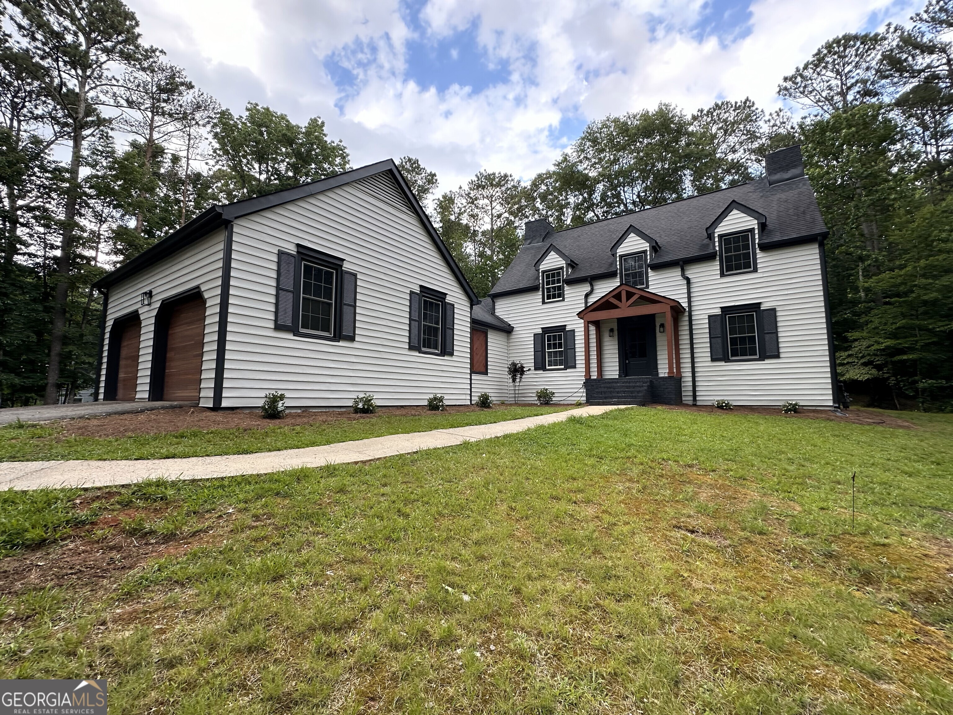 Welcome HOME! FULLY RENOVATED HOME IN NORTH PEACHTREE CITY ON 1.3 ACRES WITH NO HOA. Don't miss out on this absolutely GORGEOUS with no expense spared on this complete remodel! As you pull into the oversized driveway you will be greeted with brand new custom cedar garage doors and a new front porch. As you walk through the front door you will be amazed by a more open floor plan with not one but two living rooms with gorgeous brick fireplaces and new flooring throughout. The laundry room was moved from the garage to a NOW true laundry room on the main level with plenty of room to store things. Don't miss this amazing brand new chefs' kitchen with beautiful Quartz throughout, 42 inch black cabinets, built in microwave in the custom 8 by 5 island, gas range with a custom vent hood, quartz backsplash and all new appliances. WOW this kitchen is a dream! As you walk upstairs you will be greeted with an amazing owners suite with a fully renovated bathroom and custom built walk in closet. There are an additional 3 bedrooms upstairs as well as another fully renovated bathroom. The backyard was completely graded, tree stumps removed and brand new sod to enjoy. The backyard has plenty of room to add a pool and a second driveway was cleared and can be used for a detached garage. This property is very RARE to find so don't miss out on this amazing home today. This home is located in the TOP RATED SCHOOLS. Schedule a tour today. AGENTS SEE PRIVATE REMARKS.