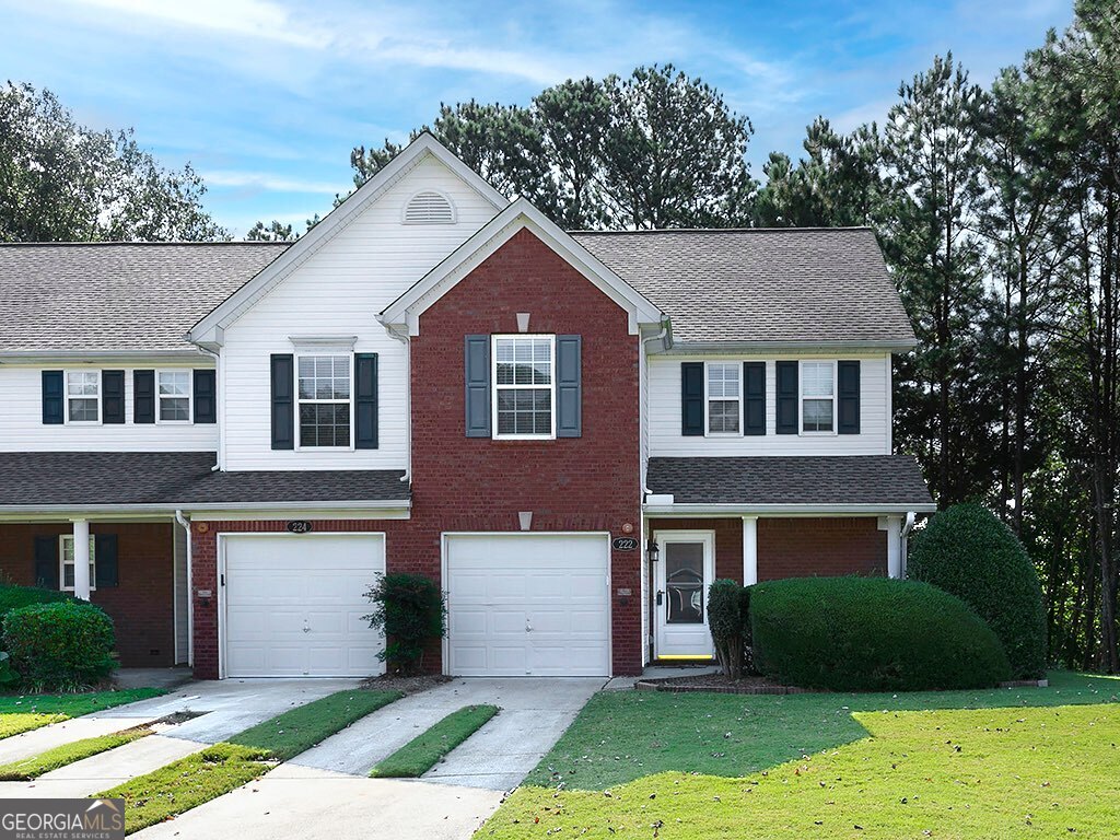 Don't miss this well maintained, end unit, two bedroom townhouse with NO HOA rental restrictions! Hardwoods throughout main floor with Primary Bedroom on Main floor. Open concept with granite countertops in kitchen, wood burning fireplace in living room that opens to a private back patio that is a delight! Home features both Cable and High fiber internet for fast connections. Upstairs is a good sized loft that overlooks the living/dining area... perfect for an office or play area. This home will go quickly.... available for quick close if needed!