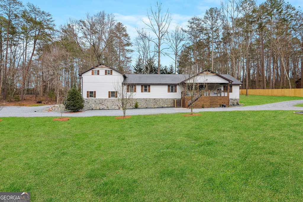 Gorgeous Luxury home located only 2 miles from downtown Blue Ridge and 1 mile from Lake Blue Ridge and Marina. Boasting 5 bedrooms and 4 full bathrooms, this newly renovated home has it all! Whip up cost-saving breakfasts, lunches, and dinners in 2 well-equipped, chef ready full kitchens. Dine indoors at the large table for eight or outdoors on your furnished deck, complete with a gas grill. Gather together in the cozy living area, warmed by a gas fireplace. Enjoy shooting some pool, foosball, shuffleboard or watch a movie on the large 75" smart tv in your own game room equipped with a jukebox for your listening enjoyment or spoil yourself outside in your very own six-person hot tub. Want to enjoy nature, build a fire and soak it in with an amazing fire pit with wood provided. With plenty of parking and the marina nearby bring your boat and enjoy lake Blue Ridge and all it has to offer. Amazing location for your forever home or an excellent income producing asset! Schedule your showing today!