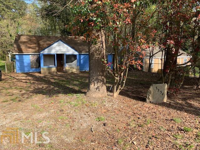 Huge corner lot across from the fabulous Sykes Park! Opportunity awaits as this fixer upper can be renovated into your next home/rental property or demo to build your dream home on almost a half acre lot. Bring your vision and tools with your offer. Please use caution when entering the property. Please do not walk on the area between the back porch and back door. Waiver required for entrance. NO BLIND OFFERS PLEASE. SCHEDULE ON SHOWINGTIME.