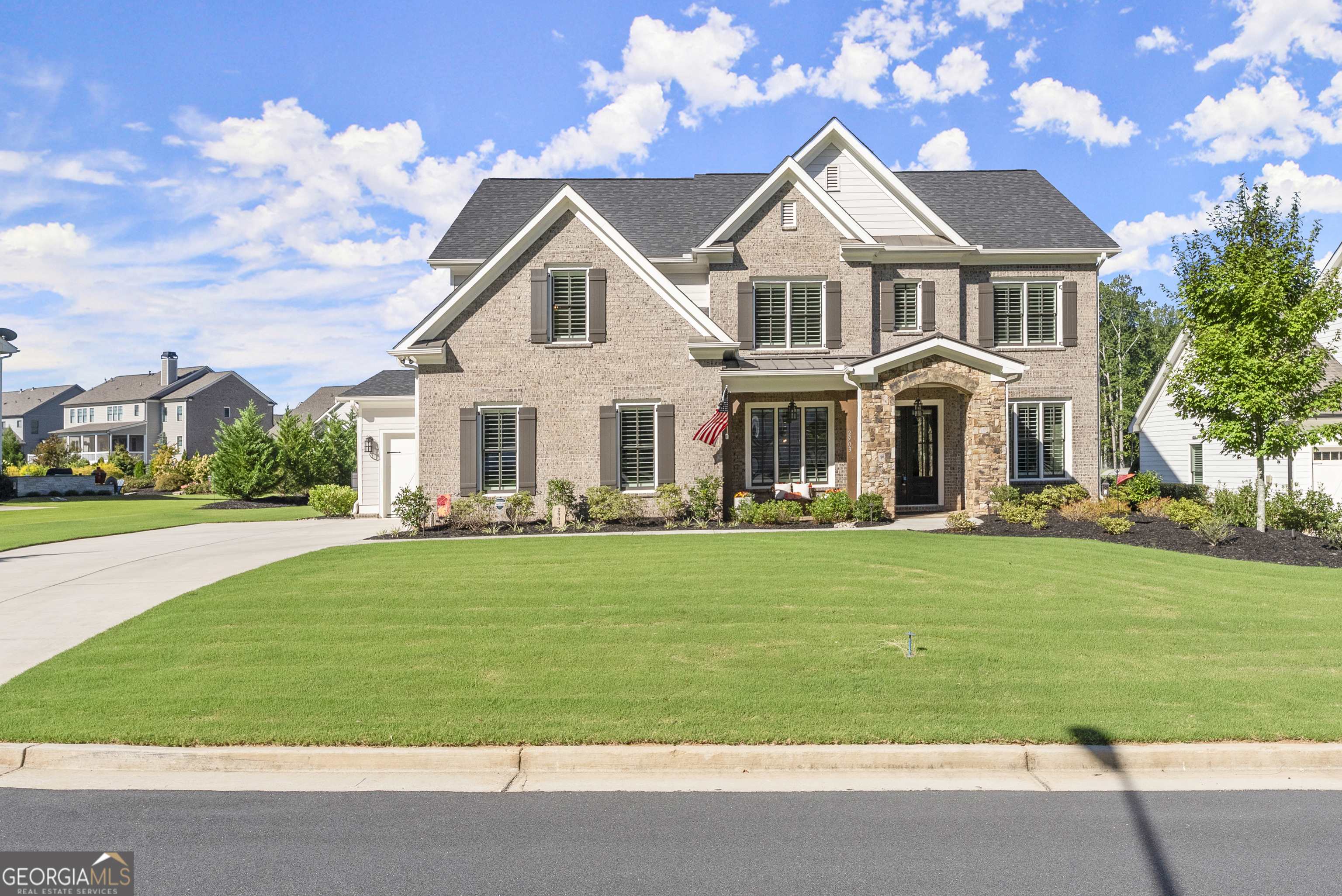 Welcome to Beckett's Walk in Acworth, one of the area's most sought-after communities with highly regarded schools and an unmatched lifestyle. This stunning 5-bedroom, 4-bath, 3-car garage home, is in immaculate condition, enhanced with thoughtful luxury upgrades at every turn, & comes with a 1 year home warranty! With a 2022 completion date, this home already feels like brand new, with all systems and appliances in pristine condition, and shows like a model home! At first glance, it makes a statement as one of only a few brick-front homes in the neighborhood, accented with timeless stone details and exterior lighting, that makes a striking first impression and curb appeal. The home sits on a spacious, level lot with professionally landscaped grounds, an irrigation system, and ambient landscape lighting. Step inside and you'll notice the attention to detail with high ceilings, exposed beams, plantation shutters, custom trim, shiplap accents, french doors, and wainscoting-all adding warmth, and a sophisticated yet welcoming feel. At the heart of the home, the kitchen offers every upgrade a cook could want-double ovens, 5-burner stove, and a butler's pantry for effortless entertaining. With luxury grade granite, 42" soft-close cabinets, and designer lighting, it's equal parts beautiful and practical. The spa-like owner's bath features premium granite, a dual vanity, freestanding soaking tub, and frameless glass shower, with a private water closet for added comfort. Custom wood shelving and a 16-drawer dresser-style island in the owner's closet, plus built-in wood pantry shelving and a 25-bottle wine display, afford maximum storage throughout. The epoxied garage floors shine like a showroom and reflect pride of ownership. The designer finishes, and immaculate condition, make this home truly move-in ready. As an added bonus, the seller is including over-the-top extras you won't find anywhere else: a stainless refrigerator, washer & dryer, outdoor grill with mini fridge, and a 6-person hot tub, making this home an entertainer's dream from day one. Ideally situated near Hwy 92 and I-75, with Lake Allatoona, Lake Acworth, and numerous parks just minutes away, it offers endless opportunities for boating, fishing, hiking, and outdoor fun. This property is more than just a house-it's a lifestyle. This is a rare chance to own a beautifully upgraded home, that blends timeless details with modern convenience, in a highly sought after location!