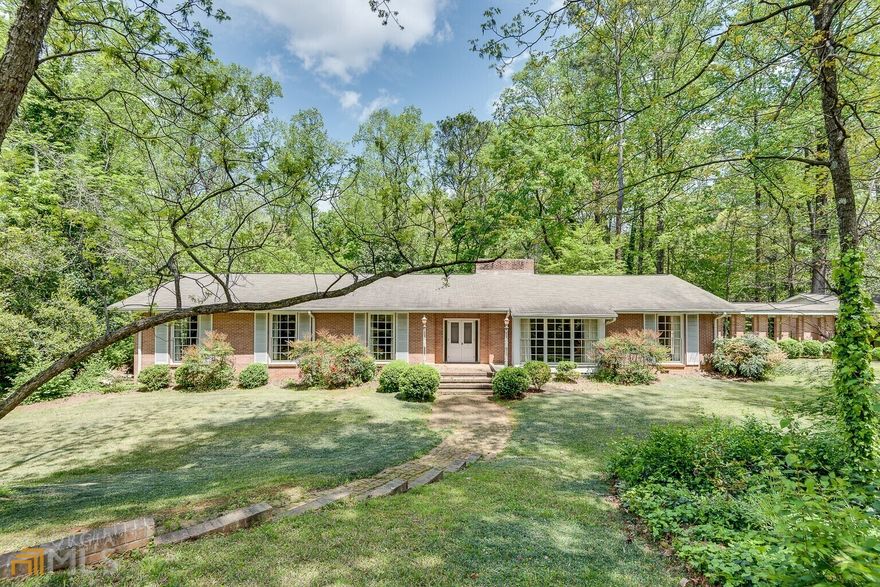 Attention builders/ renovators! Great opportunity! This beautiful four sided brick ranch home features 4 bedrooms, 3 bathrooms, a basement, and sits on two lots and one acre of land in the Heart of Oak Grove. Step inside to many sunny and bright rooms and spaces. Spacious light and bright living room and separate dining room, hardwoods, floor to ceiling brick fireplace, 2 car carport. The terrace level walks out onto a screened porch sunroom that overlooks the large private fenced in backyard. Close to Emory, CDC, CHOA. Easy access to shopping, highways, restaurants, parks,trails, shopping and so much more!