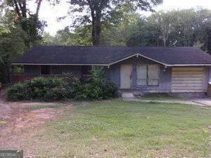 Opportunity knocks! This 3-bedroom, 1.5-bathroom ranch-style home in Forest Park is packed with potential and waiting for the right investor or handy buyer to bring it back to life. The wooded private lot features: Spacious layout with bonus room - perfect for office, den, or 4th bedroom Extra Parking pad for off-street convenience, Fenced yard. Located near highways, shopping, and public transportation Minutes to I-75, I-285, and Southlake Mall Needs some TLC - ideal for investors, flippers, or DIY buyers looking to add value and equity. Priced to sell - don't miss your chance to grab this diamond in the rough! solid rental or resale potential in a convenient location.