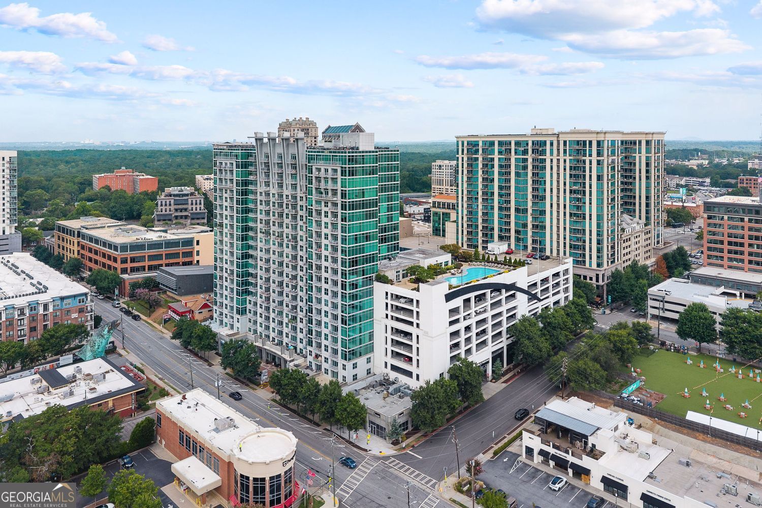Soak in stunning skyline views from this beautifully updated 1 bed, 1 bath condo in the heart of Atlanta.***Rare perks include 2 deeded parking spaces and a private storage unit*** A true luxury in city living. Featuring floor-to-ceiling windows, an open-concept layout, new hardwood floors, and a renovated kitchen, this light-filled home perfectly blends modern style with everyday comfort. The spacious walk-in closet includes built-ins, and the laundry room is enhanced with custom shelving for added convenience. Enjoy resort-style amenities such as a brand-new rooftop pool, 24-hour concierge, fitness center, club room, game room, and outdoor grills. Located steps from Buckhead's best-Yeppa, Atlanta Fish Market, Fetch Dog Park, and premier shopping and dining. This condo offers low-maintenance, high-style living.
