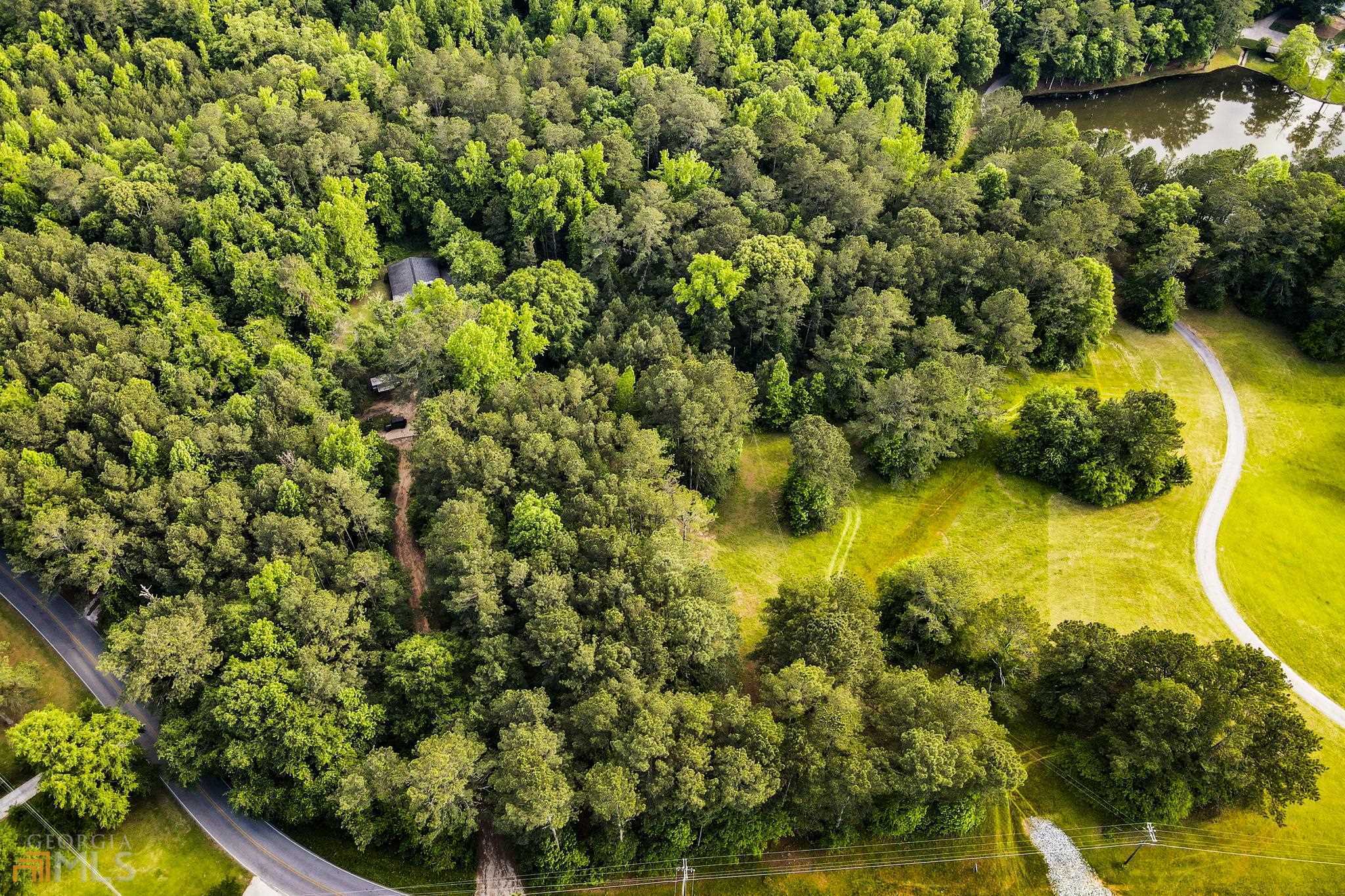 2 RESIDENTIAL LOTS ON 6 ACRES, ACROSS FROM PIEDMONT HOSPITAL AND CLOSE TO TRILITH STUDIOS! Both parcels are being sold together. Perfect for building your dream home, family compound, or for a builder to build 2 houses! See survey in docs - Tract 6 is 2.389 acres and Tract 5 is 3.666 acres, both with seasonal views of neighboring lake. Tract 5 has creek on lower side.