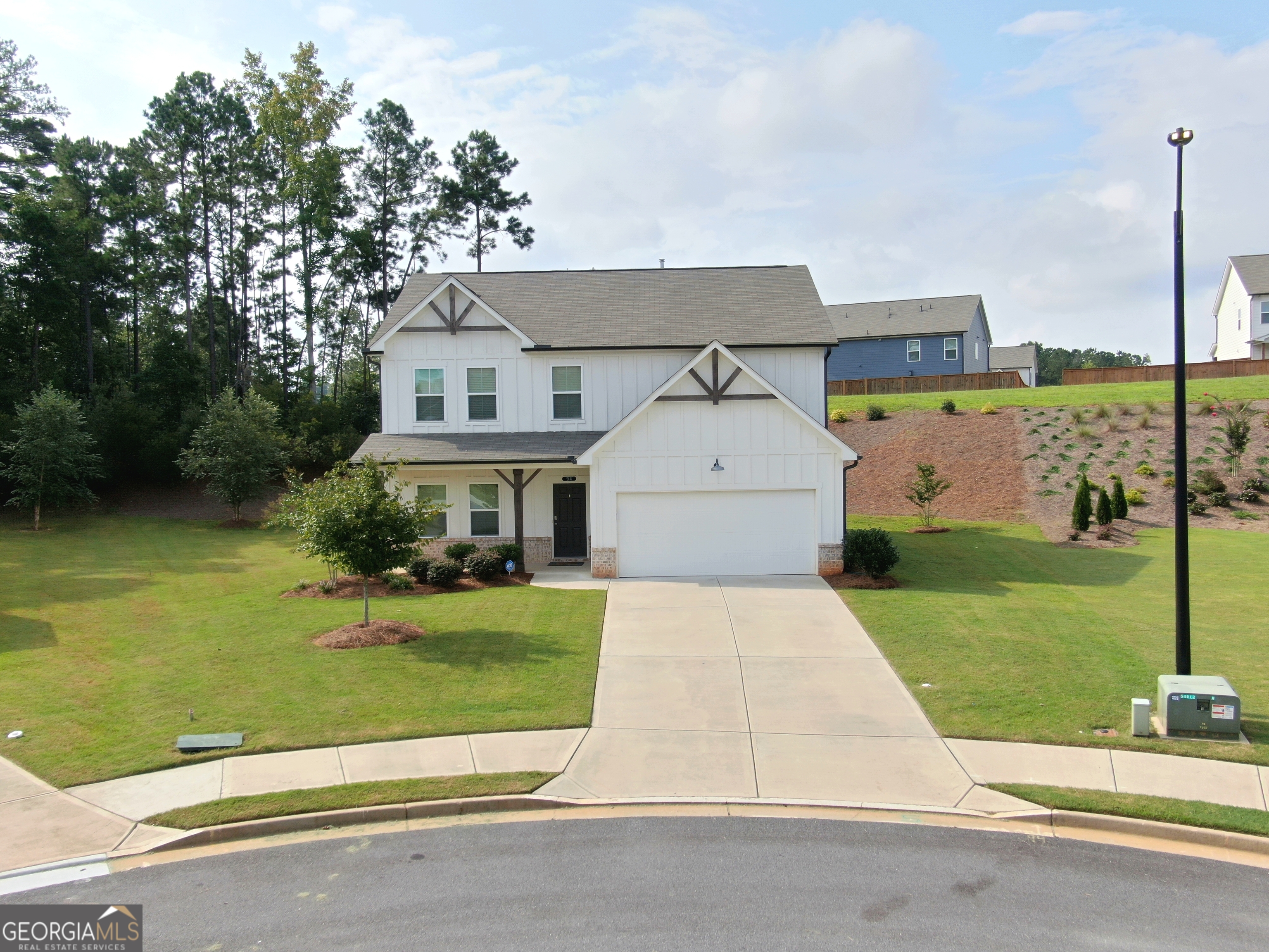 Welcome Home to Acworth! This beautiful 4-bedroom, 2.5-bath residence blends modern comfort with timeless style, offering the perfect retreat for families who love both entertaining and quiet evenings at home. Step inside to discover a bright and open floor plan. The spacious living room with a cozy fireplace sets the tone for gatherings, while the large windows flood the space with natural light. The modern chef's kitchen is a showstopper complete with stainless steel appliances, a central island, custom backsplash, and plenty of storage. Enjoy casual meals at the island or host dinner parties in the elegant dining room with stylish lighting. Upstairs, the primary suite is a true retreat with space for a sitting area, a spa-inspired bathroom with dual vanities, soaking tub, and walk-in shower. Three additional bedrooms provide flexibility for family, guests, or even a dedicated home office. The loft area upstairs offers a cozy second living space perfect for movie nights, a playroom, or a quiet reading nook. Step outside and enjoy a generous backyard and lush landscaping, offering plenty of room for kids, pets, or weekend barbecues. The covered front porch and curb appeal make this home truly stand out in the neighborhood. Located in the heart of Acworth, GA, you'll be just minutes from excellent schools, shopping, Lake Allatoona, and I-75 for an easy commute.