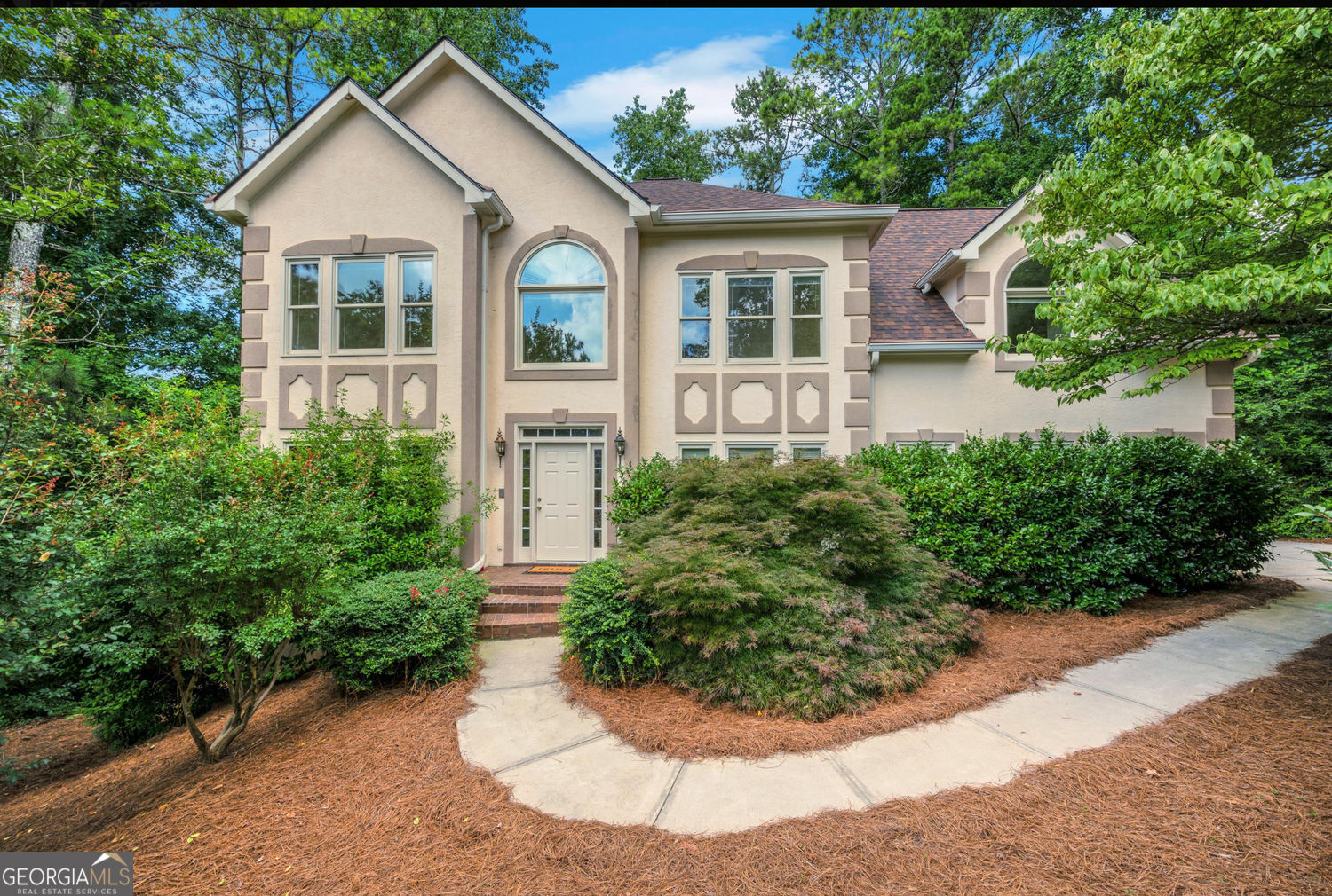 Traditional Elegance with Lake Views in Sought-After East Cobb! Welcome to this stunning home nestled in one of East Cobb's most desirable communities-boasting a Roswell address with the benefit of Cobb County taxes. This spacious 4-bedroom, 2.5-bath residence combines classic charm with high-end kitchen and systems updates and breathtaking lake views from nearly every room. Step into the heart of the home: a beautifully renovated chef's kitchen featuring a Moen undercounter double sink, prep sink, Thermador double ovens, professional-grade 6-burner gas cooktop, two disposals, luxurious granite countertops, and custom cabinetry designed for both functionality and style. The open family room overlooks the lake-you will feel like you're on vacation! Upstairs, an oversized primary bedroom suite has extra space for a sitting area plus double vanities and separate tub/shower for your customization. Three secondary bedrooms offer great space and include a large bonus room with rear stairs to the kitchen. Enjoy peace of mind with major upgrades including a new roof (2025), new HVAC system (2024), gutter guards, and double-pane windows throughout. A 9000-watt generator ensures key systems remain powered during outages, and an air compressor hookup offers convenient tire inflation right from home. The home backs directly onto the neighborhood lake-offering the best views in the community, with access from the driveway, deck, or walk-out basement. The newly painted oversized deck made of Brazilian hardwood includes a cozy nook for a grill, while the covered patio below offers a serene spot to relax by the water. Additional features include a partially finished daylight basement, stubbed for a bath with room for a workshop and abundant storage, custom-coated garage floor with built-in storage, extra-wide driveway with 3" PVC conduit beneath-ideal for future irrigation or outdoor lighting projects. This rare gem blends practical upgrades with luxurious finishes and unbeatable scenery. The active HOA includes, swim, tennis, a playground and a clubhouse for your enjoyment.