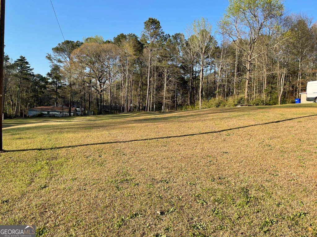 Photo of 7203 woodland ave, covington, GA 30014 (MLS # 10715398)