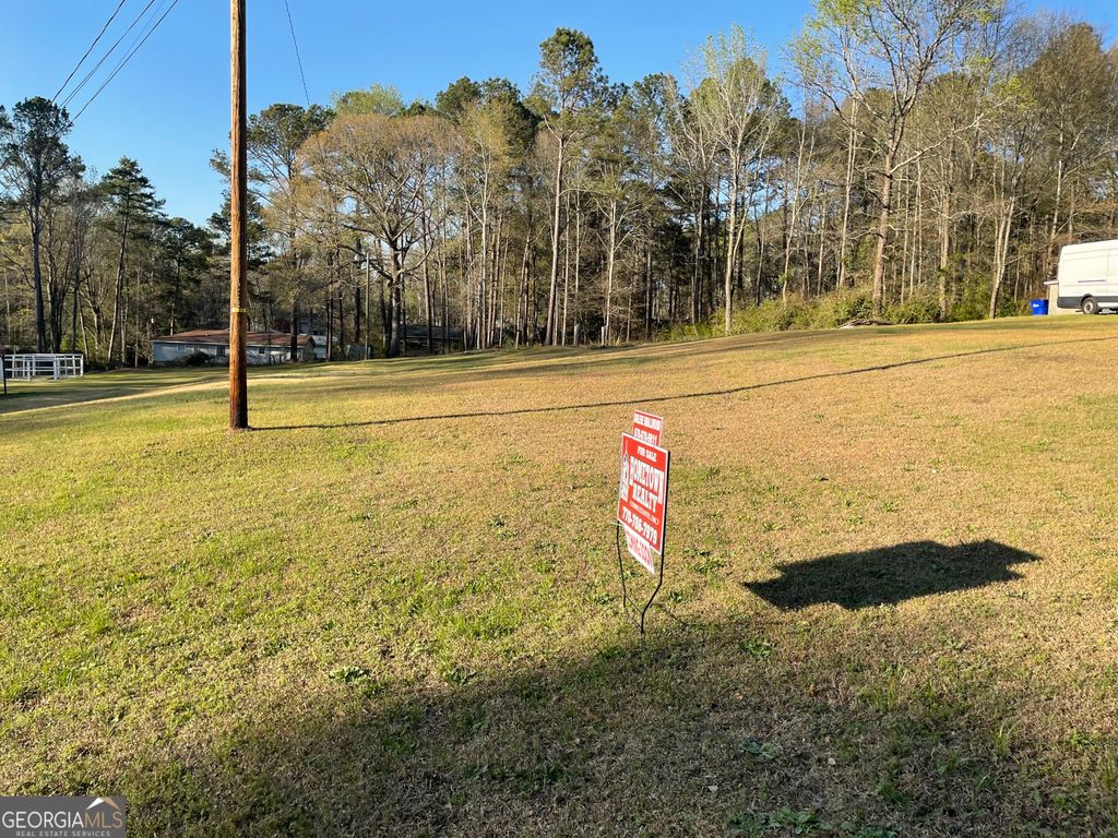 Photo of 7203 woodland ave, covington, GA 30014 (MLS # 10715398)