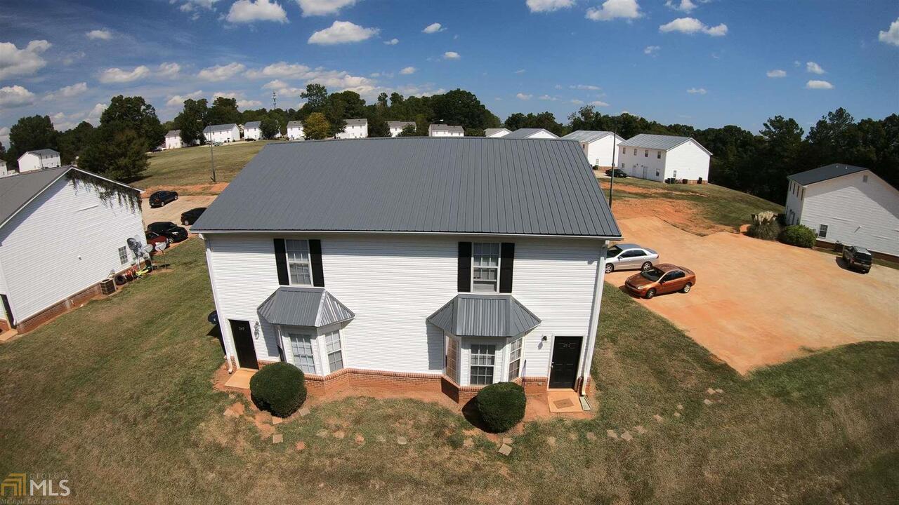 Newer Town homes built as duplexes with patios and lots of parking. Easy drive to UGA. Great location! Lives like a home so tenants love it. Consist of 36 of 48 townhomes in the community. Each unit is 4 bedroom/3 bathrooms with market rent of $1100 per unit. Current rents are below market with the current monthly rent roll as of 10/1/2019 of $32,390 but increasing several hundred every month with rent increases and as units turn. Rent roll available upon signing non disclosure agreement. Current owner is raising rents at renewals and for new tenants. Current owner is president of HOA and new owner/manager would assume this. HOA fees go back to $50 a month. New roofs in 2019. Many updates such as Luxury Vinyl Floor and some new HVACs. Contact listing agent for brochure.