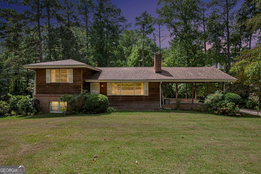 This home features a WORLD of possibility! Located in a very sought-after part of Marietta, this home is situated on 2.5 Acres which could be rezoned into gorgeous commercial or mixed-use property. This could also just be a home you call your own, with a little TLC and some updating this beauty with the land could easily be very equity-rich. Home has two kitchens and two living spaces with 4 bedrooms and two baths. The home is set up with a roommate floor plan in mind, there is so much that you could do with the abundance of space. The Land is flat and extremely useable. Come and see it today, let your imagination take over.