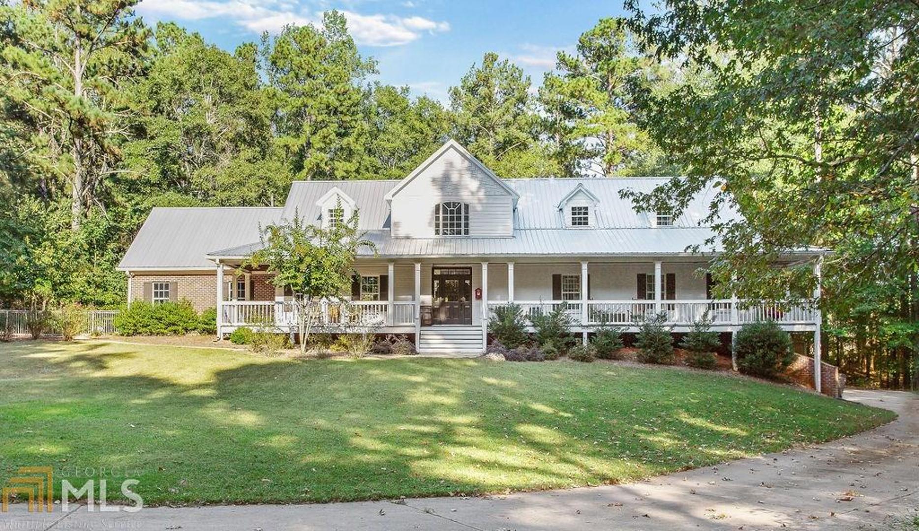 Decorator's Dream! The Southern Living- style front porch welcomes you into a light & bright entryway, featuring hardwood flooring. Upgrades abound, such as iron spindles, TWO oversized master bedrooms, a beautiful bright kitchen with granite countertops & custom cabinetry, keeping room/dining area with shiplap focal point, & a loft area built for the whole family! This home features giant garages that can hold 7+ vehicles with plenty of room to work on them! You'll love spending time in the in-ground salt water pool, as well! Maintained to perfection- call today!