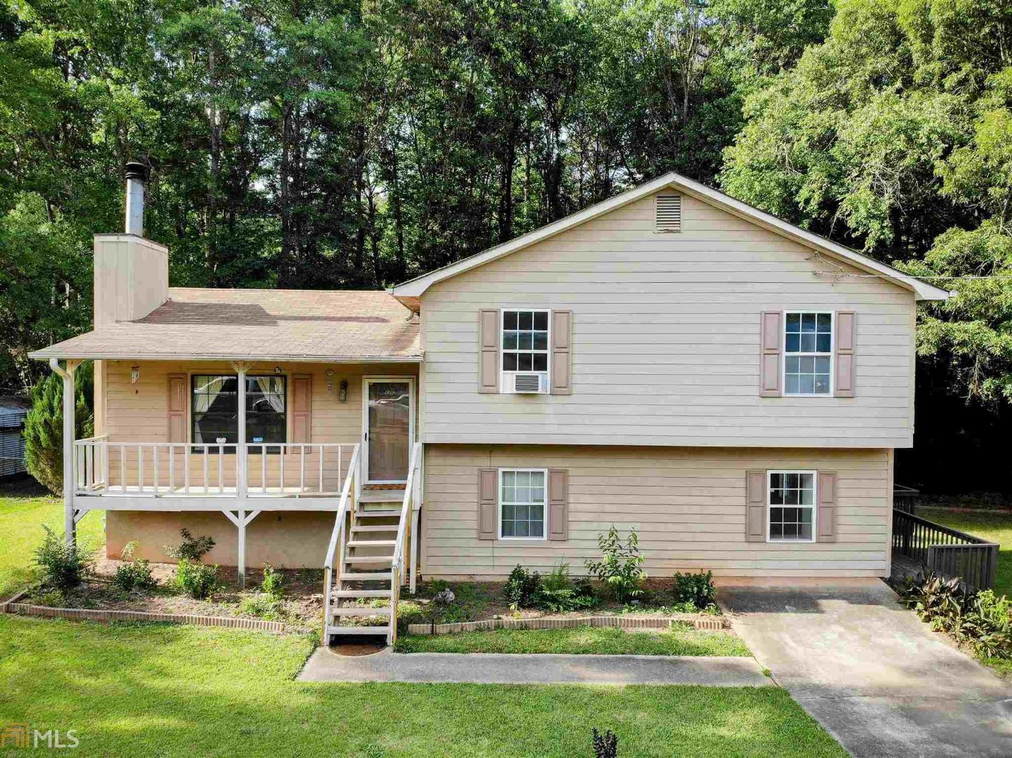 Spacious Updated 4 Bedroom 2 Bathroom on Almost 1 Acre! Updated Kitchen and Family Room! Finished Basement! 4 Car Detached Garage! Fenced Backyard Ready for Pool/Playhouse/Trampoline/Firepit/Etc! Additional Parking for RV/Boat! No HOA! Just Minutes to Downtown D'ville, Mall, Restaurants and I-20! Just 30 Minutes to Downtown ATL & The Atlanta Airport!