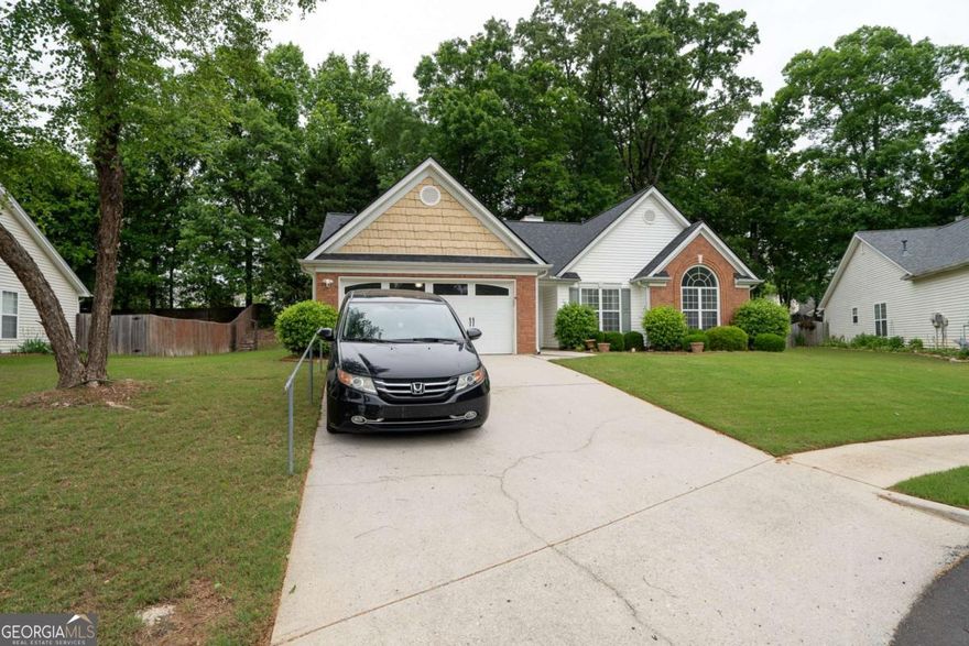 Motivated Seller! $2000 towards closing costs.  Welcome home to this beautifully maintained ranch with a charming brick front, located 5 minutes from Hwy 85 in Hamilton Mill, in the sought after Ivy Creek and Seckinger School District.   High vaulted ceilings, neutral colors and abundant natural light is very inviting. The living area includes an entrance foyer, a fireside living room, a separate dining room, a lovely sunroom and an eat-in kitchen. The kitchen has vaulted ceilings, including a kitchen island. The oversized owner's suite boasts vaulted ceilings, a walk-in closet and an en-suite bath featuring dual vanities. Lots of windows and lots on sunshine in the home.  Additional highlights of the home include spacious secondary bedrooms with crown molding and ceiling fans, along with a large secondary full bath, a laundry room with shelving, a new water heater installed in 2024,and a 5 year old roof. The flooring in the Living room is less than 5 years old. Nestled in a quiet neighborhood, this home offers convenience with proximity to shopping, schools, and parks, making it the perfect blend of comfort and modern living.