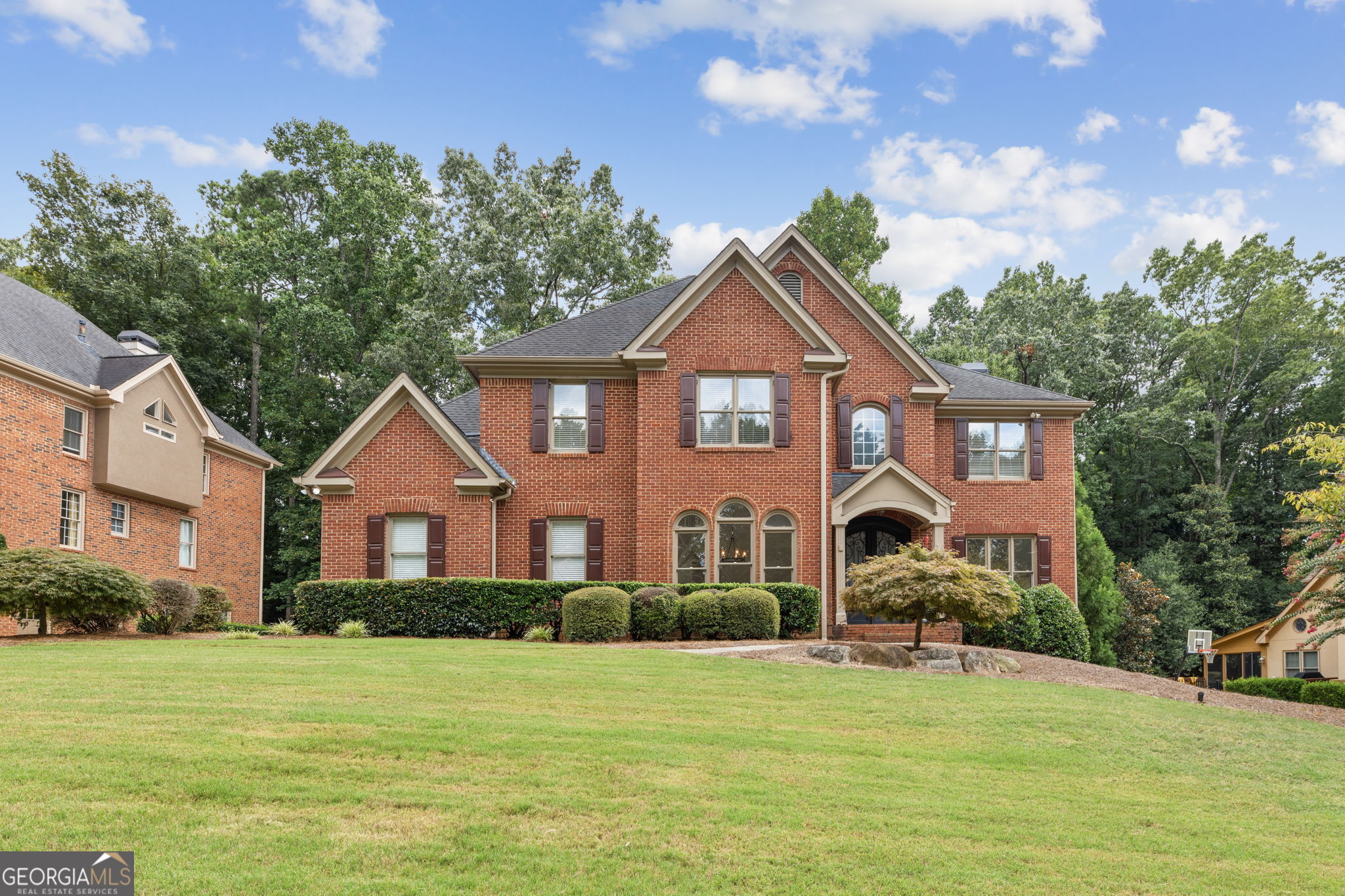 **Stunning Fully Renovated Luxury Colonial in Highly Desired Lambert High School District!** This exquisite home boasts an array of exceptional features: - A gourmet kitchen designed for culinary enthusiasts, showcasing upgraded appliances, a double oven, granite countertops, a beautiful tile backsplash, a 5-burner gas stove top, a convenient built-in desk, and an expansive island perfect for entertaining. - Elegant upgraded light fixtures, fresh paint, and luxurious new flooring create a warm and inviting atmosphere throughout the home. - A grand two-story foyer welcomes you, complemented by a formal dining room, a versatile office/flex space, and a spacious family room on the main level. - The dining room seamlessly connects to a butler's pantry that leads into the heart of the kitchen. - Relax in the family room, featuring a cozy fireplace and built-in bookshelves for your favorite reads. - Enjoy the convenience of both front and rear staircases, enhancing accessibility throughout the home. - The upper level offers five generously sized bedrooms and three full baths, providing ample space for family and guests. - Retreat to the master bedroom, complete with an opulent en-suite bathroom featuring a spacious walk-in closet, an oversized shower, an elegant soaking tub, and double sinks for added luxury. - A well-appointed laundry room on the upper floor includes a full-sized washer and dryer for your convenience. - The finished daylight basement on the lower level includes a separate walkout exit, a full bath, an additional bedroom, a bonus room, and plenty of storage. - A spacious two-car garage adds to the home's appeal. - Enjoy a large front and backyard that offers privacy and space for outdoor activities. - Benefit from a vibrant community that features a swimming pool, pickleball courts, and a beautiful lake. -Furnished Rental Option Available for this Home This home is ideally located with excellent schools, shopping, and restaurants nearby, along with quick access to Georgia 400 and I-85. Don't miss out on this incredible opportunity-call today to schedule your personalized tour!